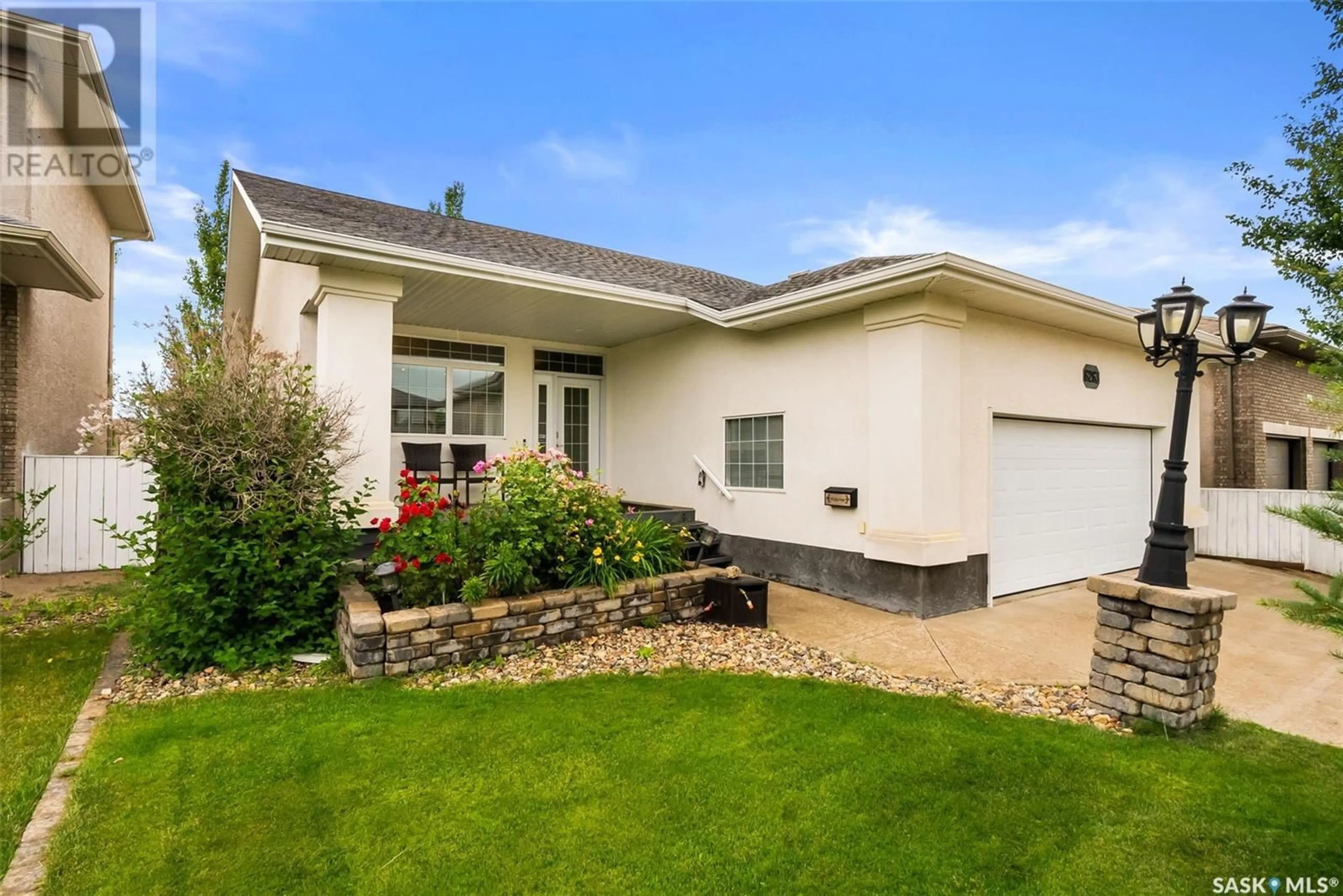 Home with vinyl exterior material, street for 6263 WASCANA COURT, Regina Saskatchewan S4V3E8
