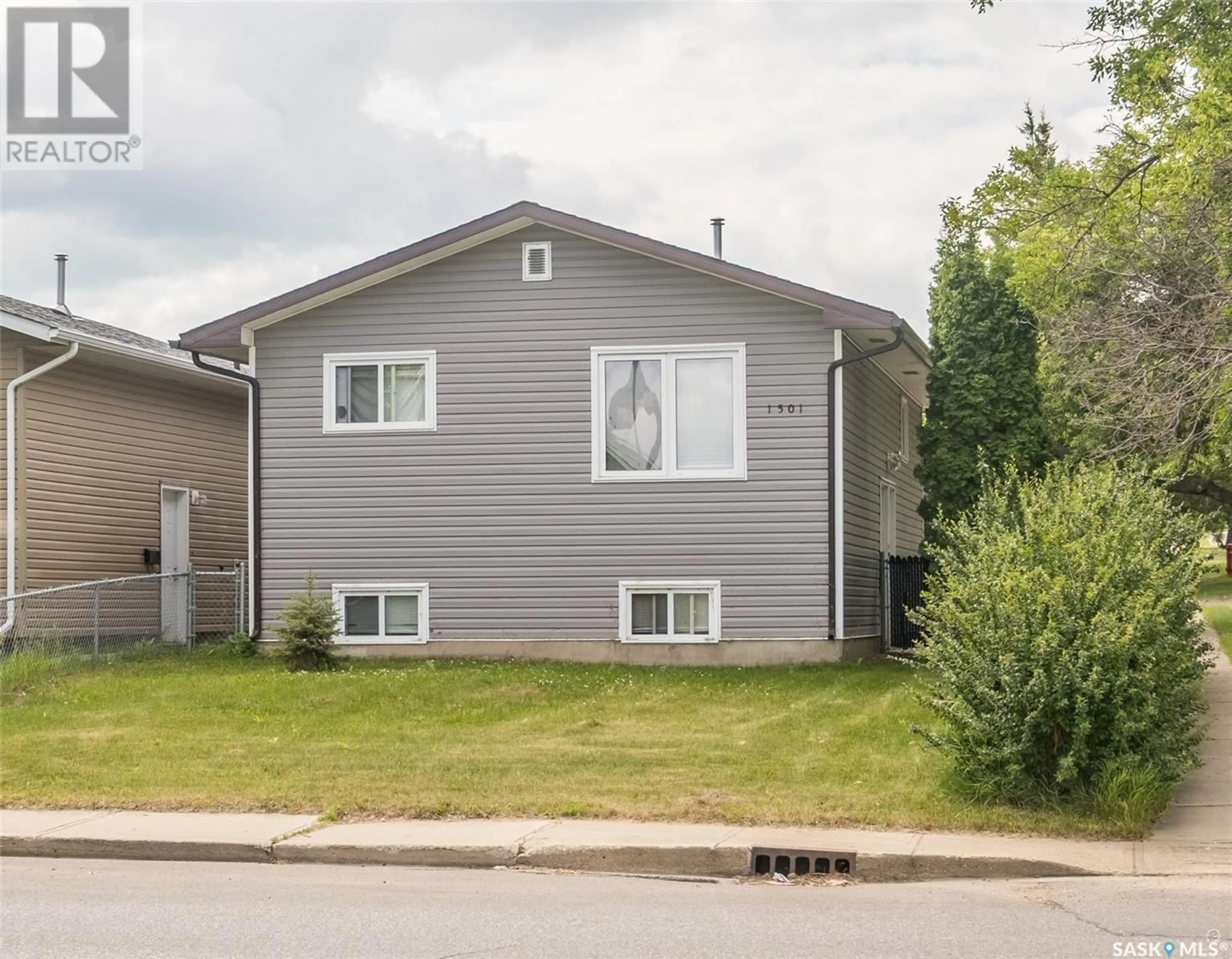 Home with vinyl exterior material, street for 1501 MCINTOSH DRIVE, Prince Albert Saskatchewan S6V7S1