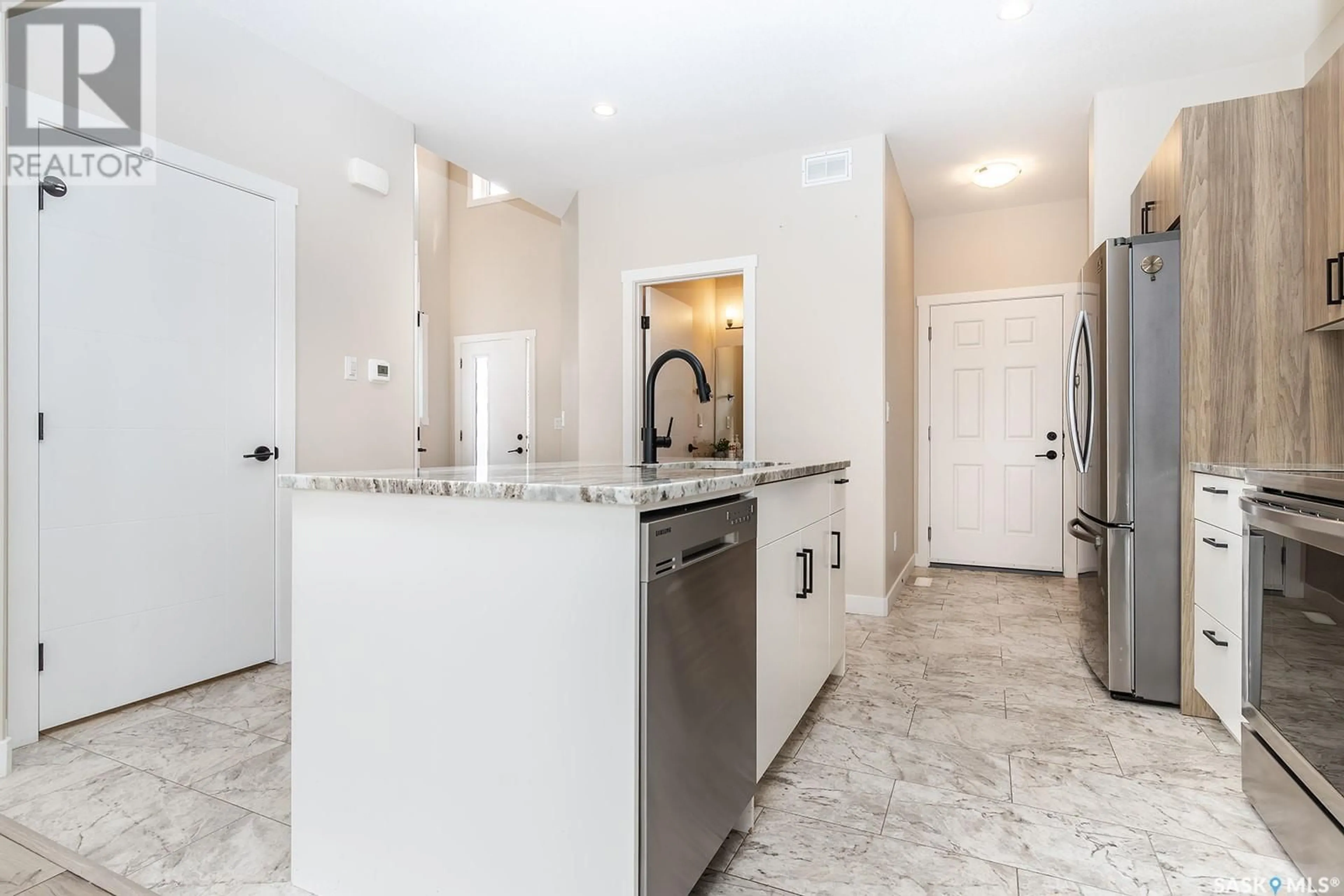 Open concept kitchen, ceramic/tile floor for 263 BARRETT STREET, Saskatoon Saskatchewan S7W1C6