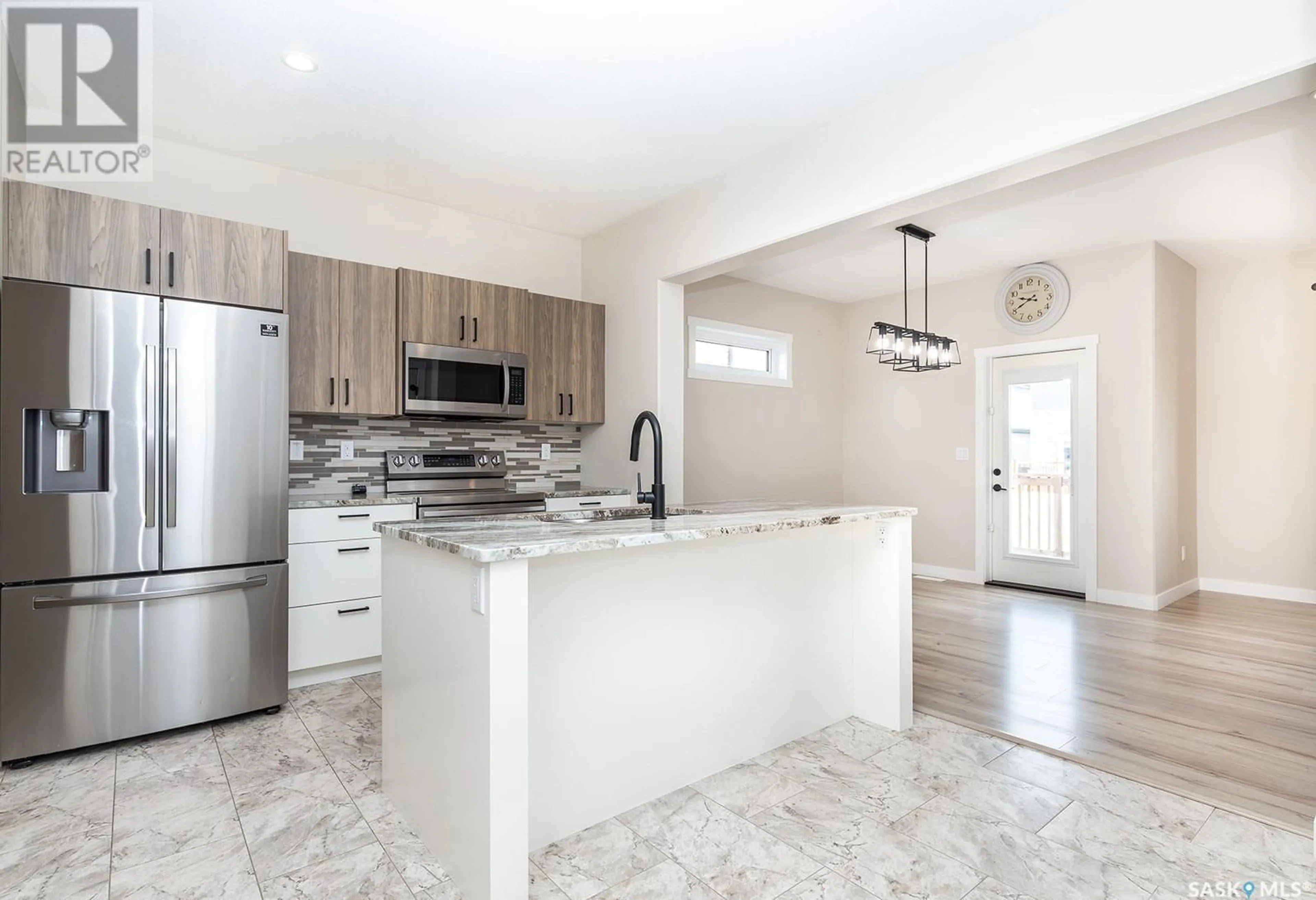 Open concept kitchen, ceramic/tile floor for 263 BARRETT STREET, Saskatoon Saskatchewan S7W1C6