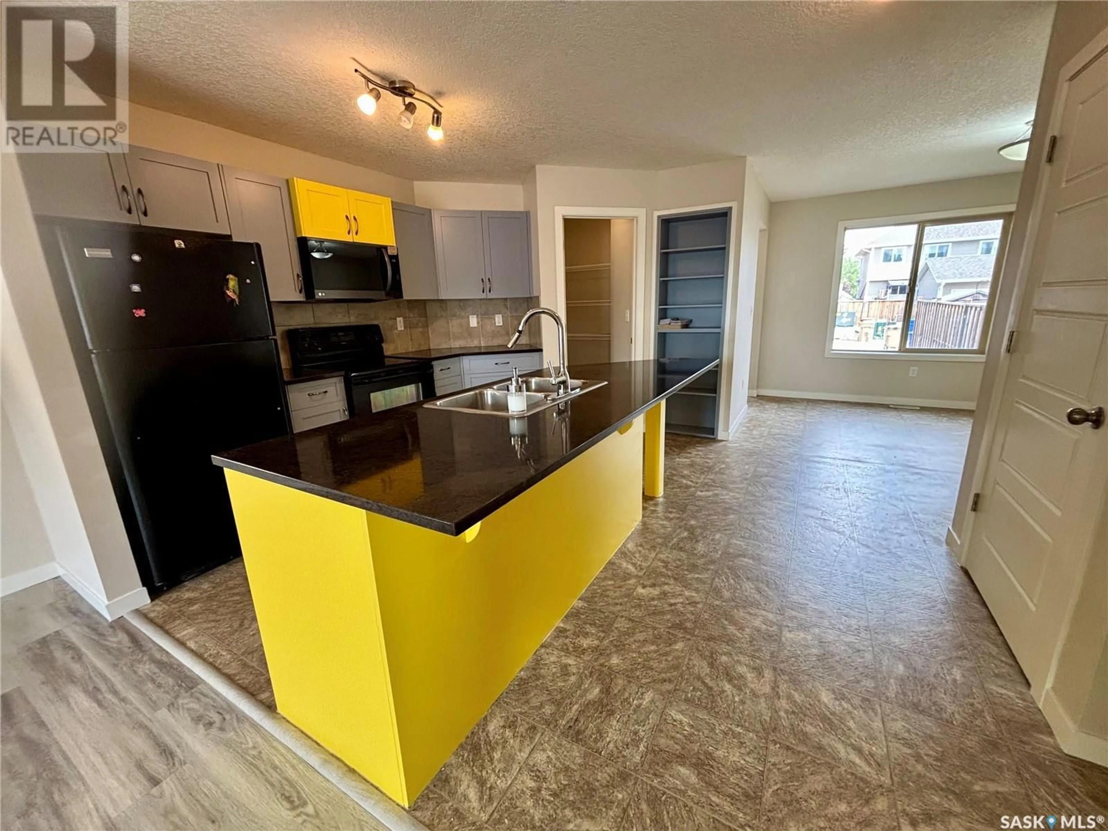 Open concept kitchen, ceramic/tile floor for 5114 MITCHINSON WAY, Regina Saskatchewan S4W0J9