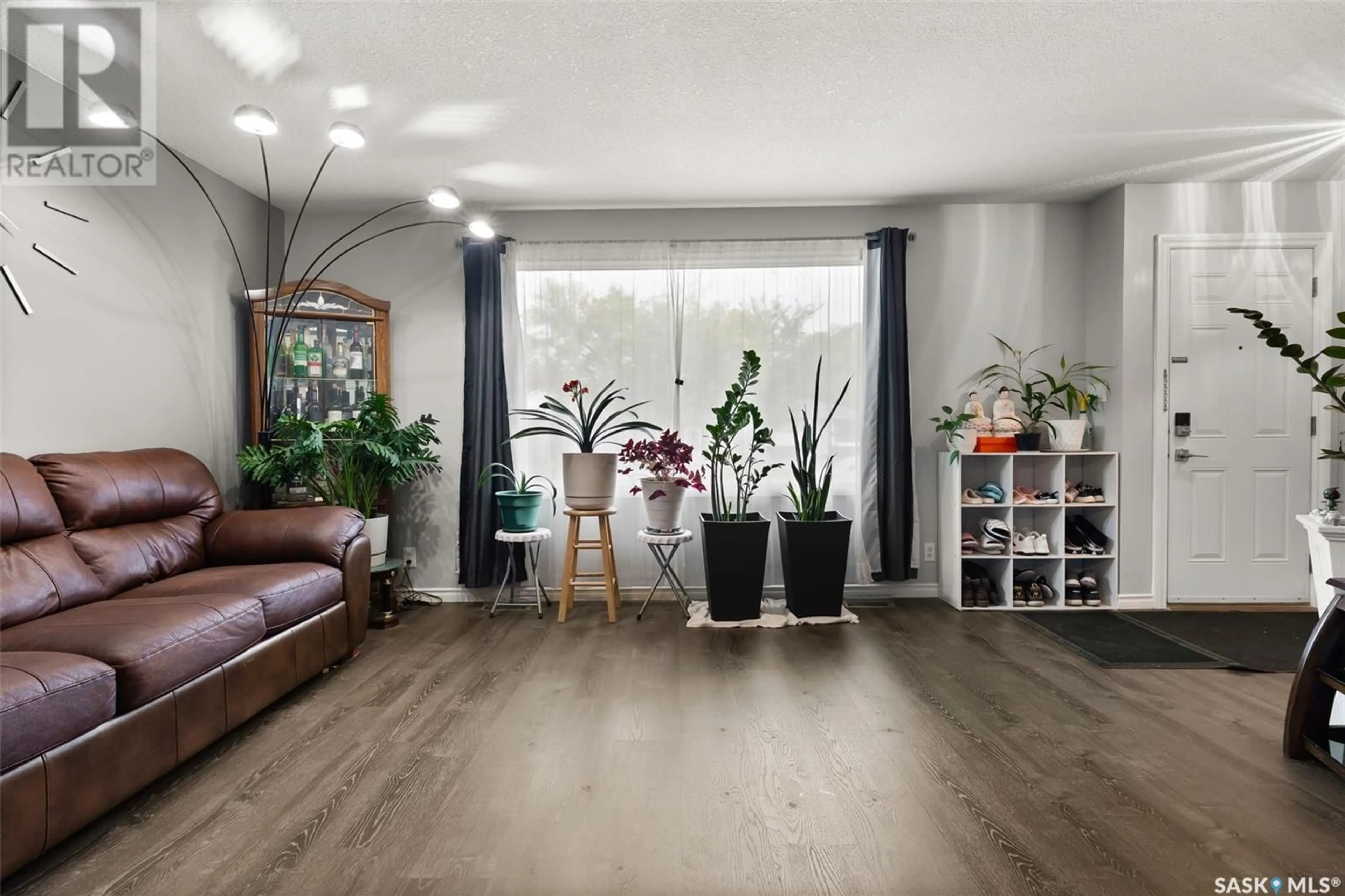 Living room with furniture, wood/laminate floor for 430 ST JOHN STREET, Regina Saskatchewan S4R1R3