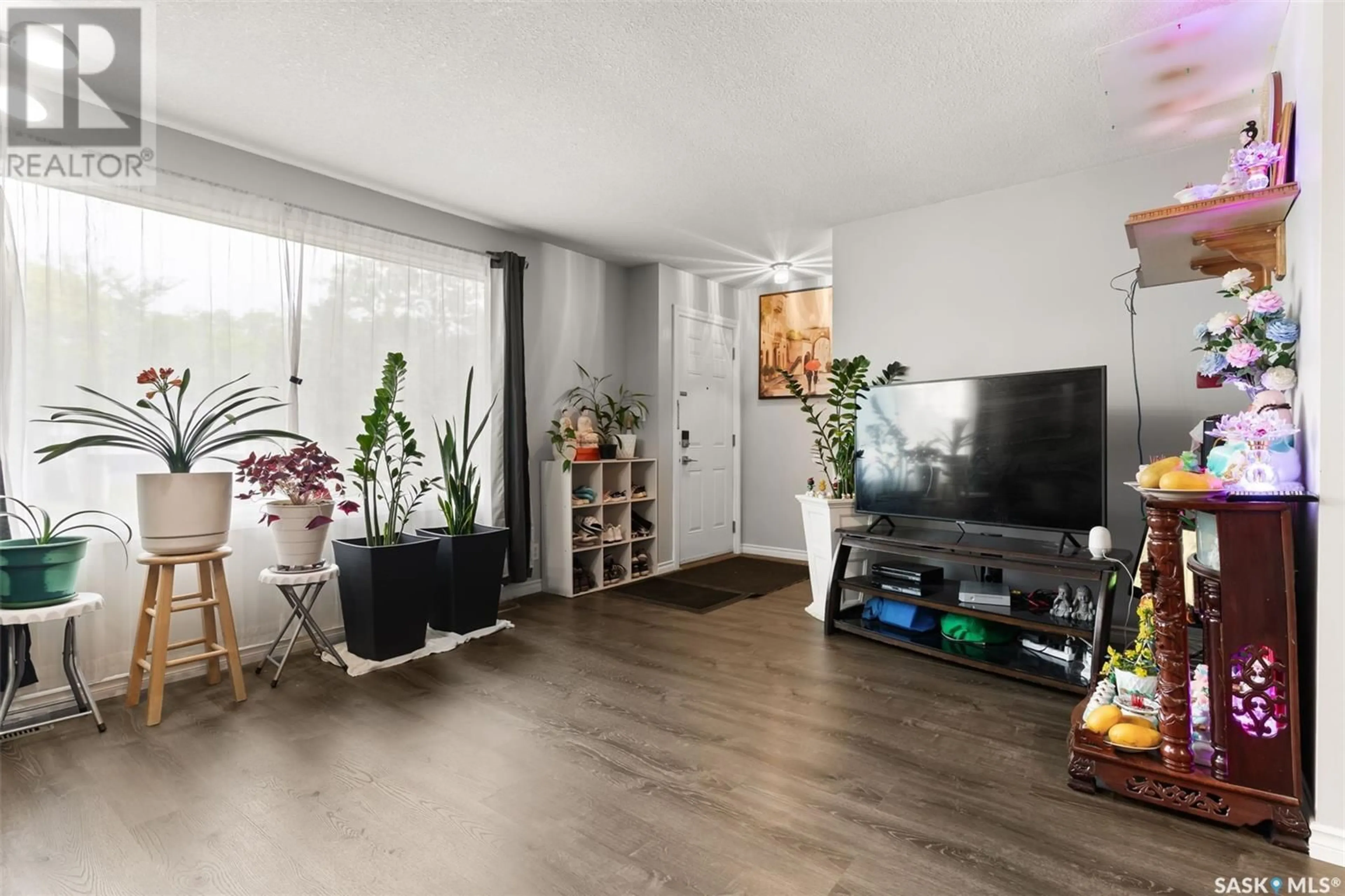 Living room with furniture, wood/laminate floor for 430 ST JOHN STREET, Regina Saskatchewan S4R1R3