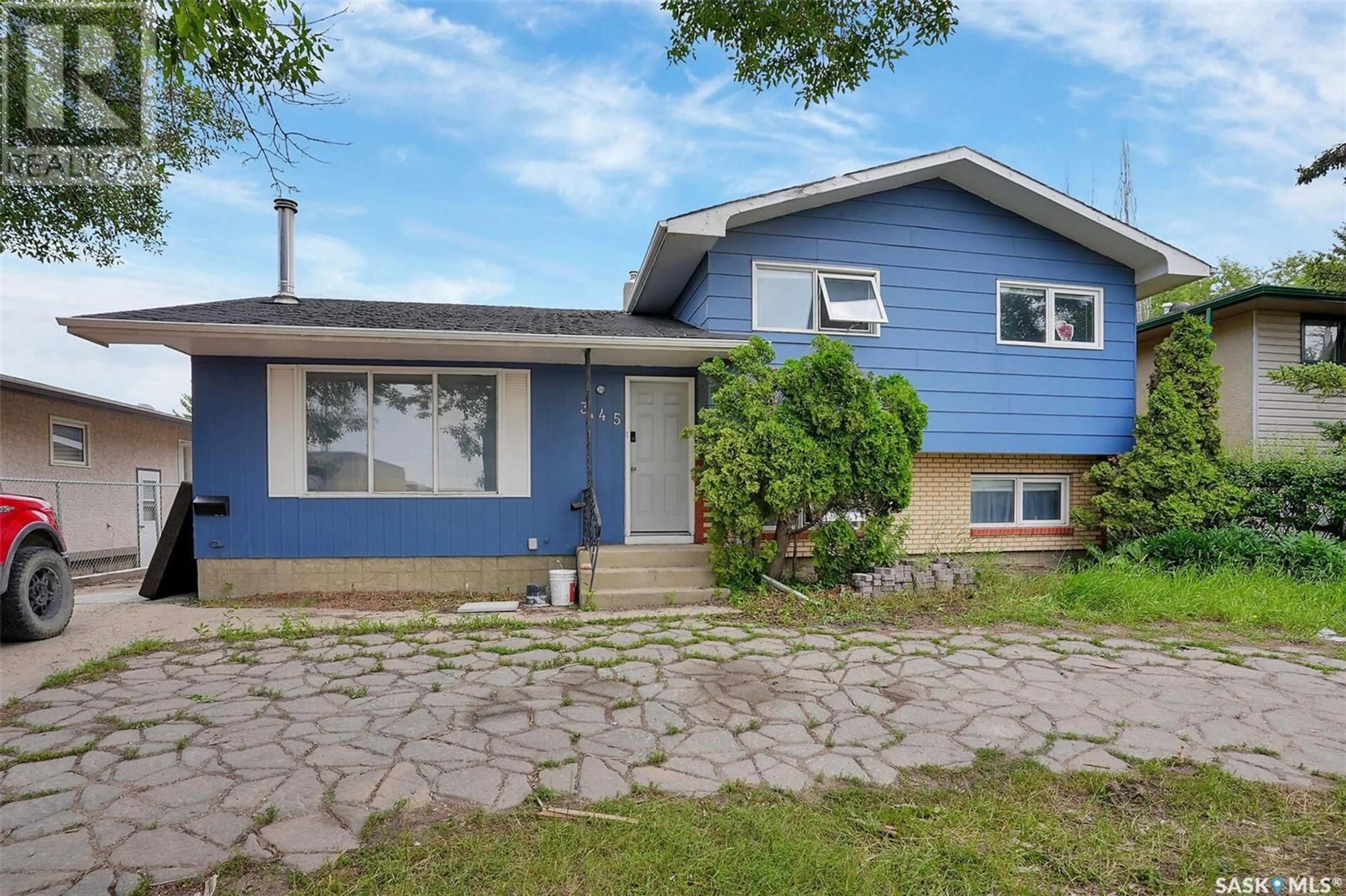 Home with vinyl exterior material, street for 345 MCCARTHY BOULEVARD, Regina Saskatchewan S4R5R3