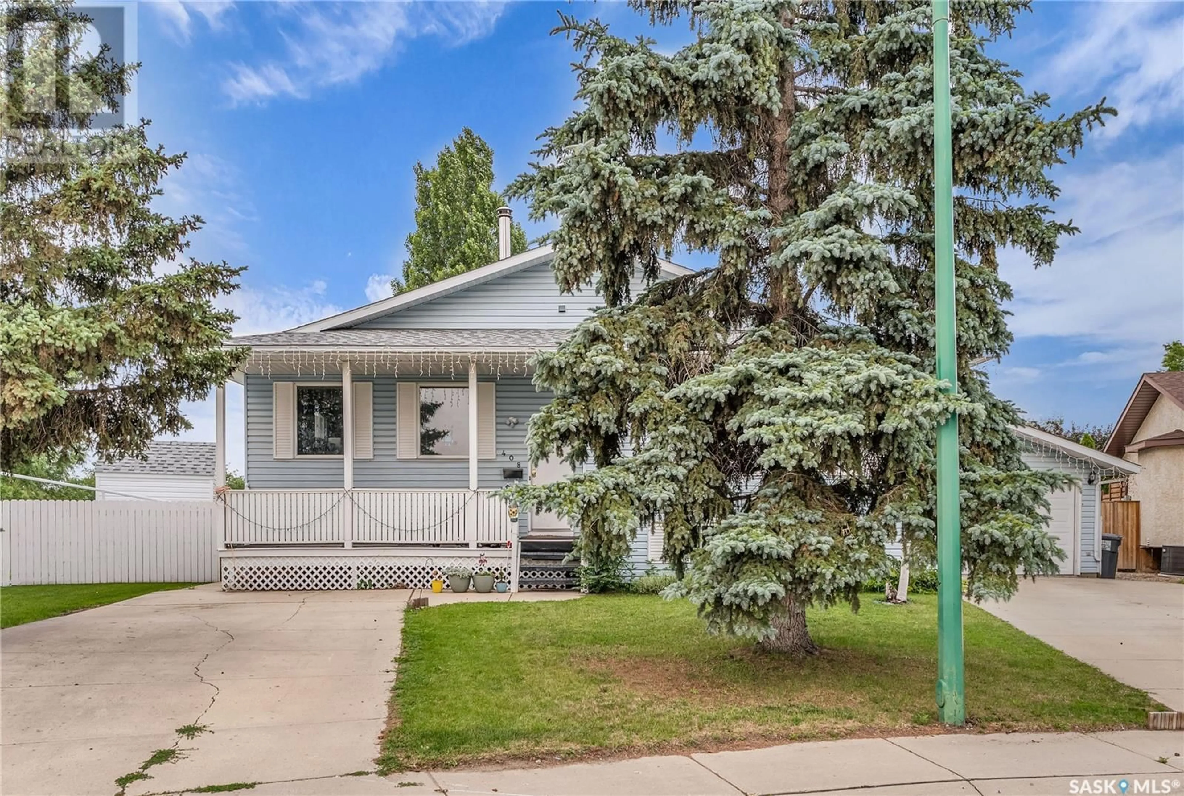 Home with vinyl exterior material, street for 406 & 408 GILLAM CRESCENT, Saskatoon Saskatchewan S7N3R6