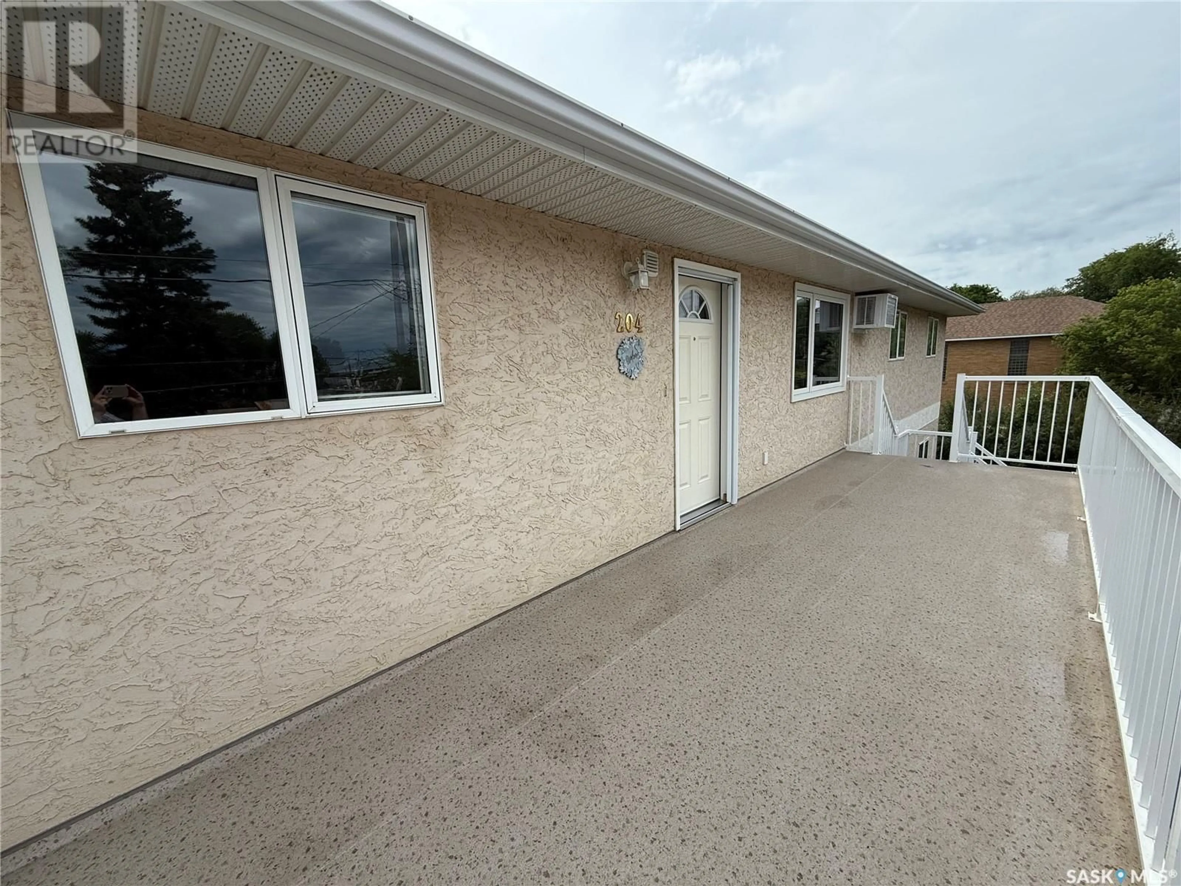 Home with vinyl exterior material, street for 204 - 1137 SECOND STREET, Estevan Saskatchewan S4A0L8
