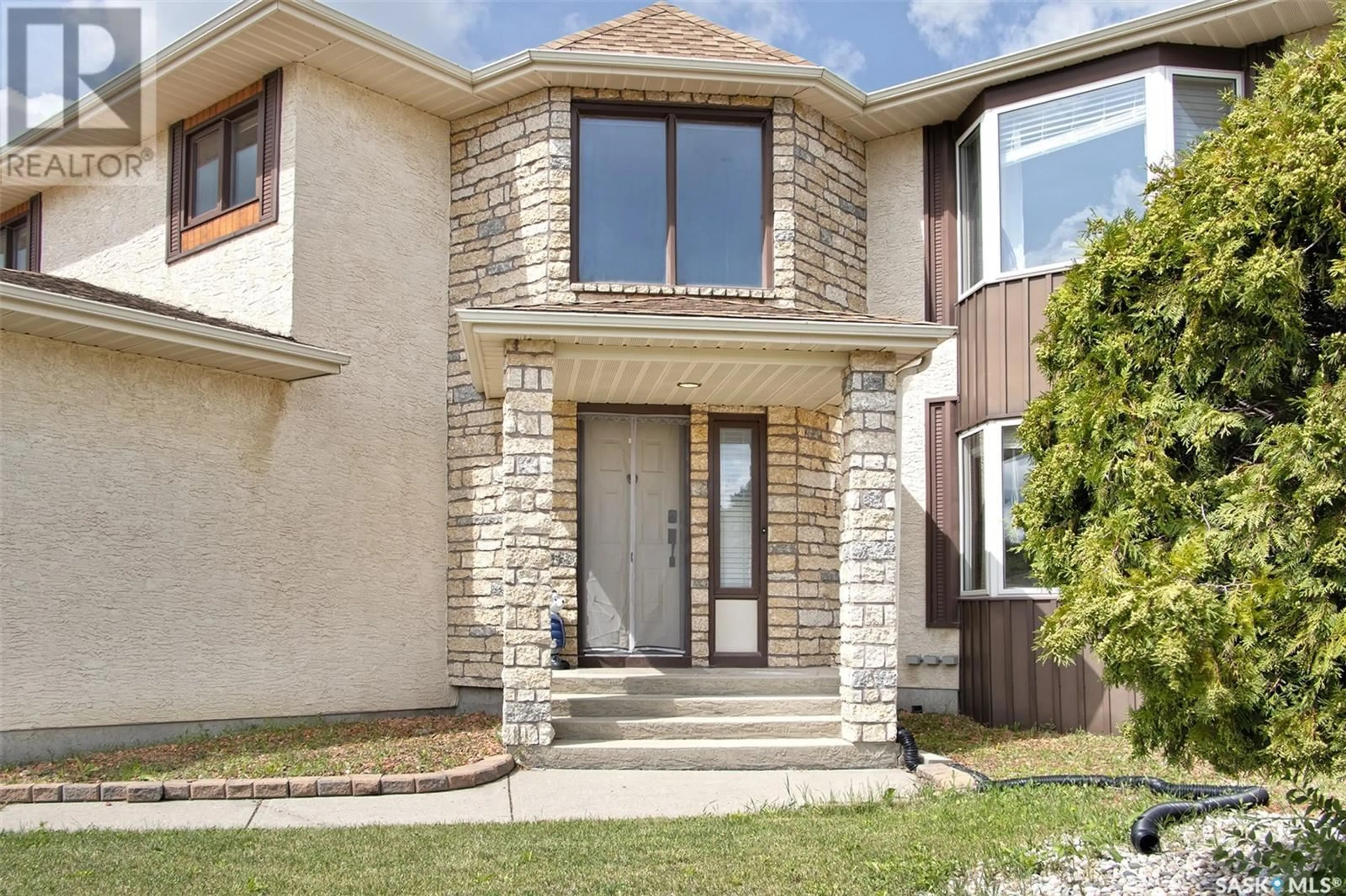 Home with brick exterior material, street for 1438 WASCANA HIGHLANDS, Regina Saskatchewan S4V2K5