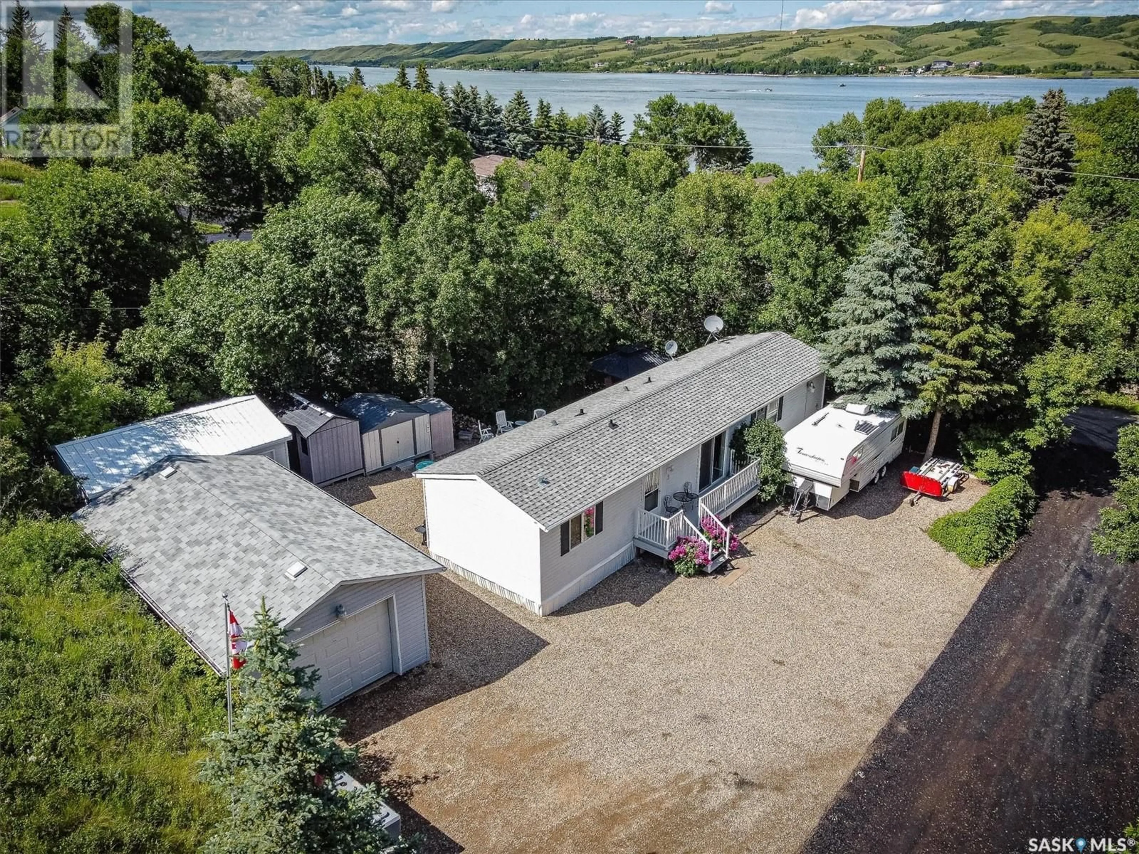 A pic from outside/outdoor area/front of a property/back of a property/a pic from drone, water/lake/river/ocean view for 2 CLARK STREET, Sun Valley Saskatchewan S0H4C0