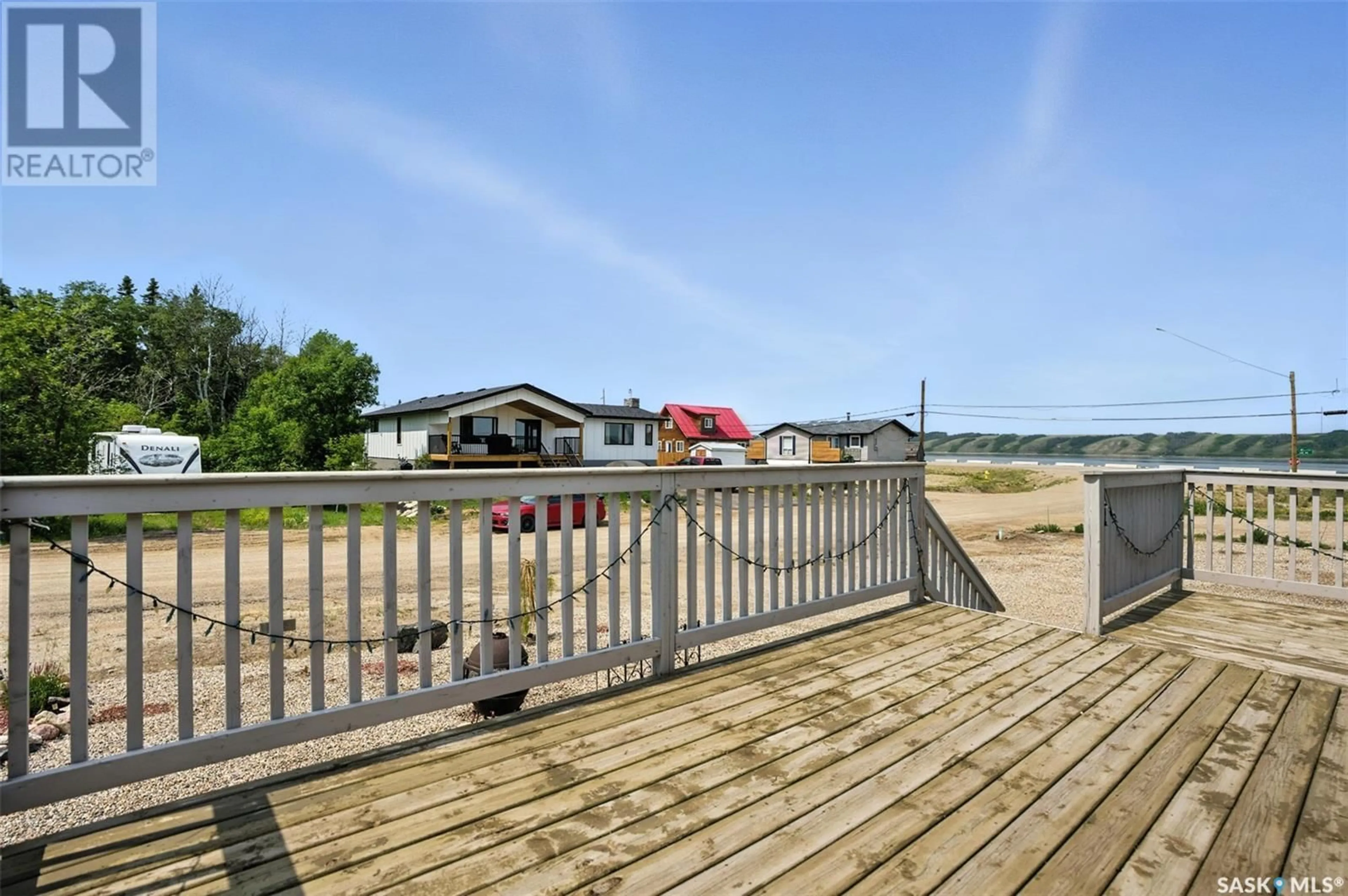 A pic from outside/outdoor area/front of a property/back of a property/a pic from drone, water/lake/river/ocean view for E - 105-104 JEAN STREET, Manitou Beach Saskatchewan S0K4T1