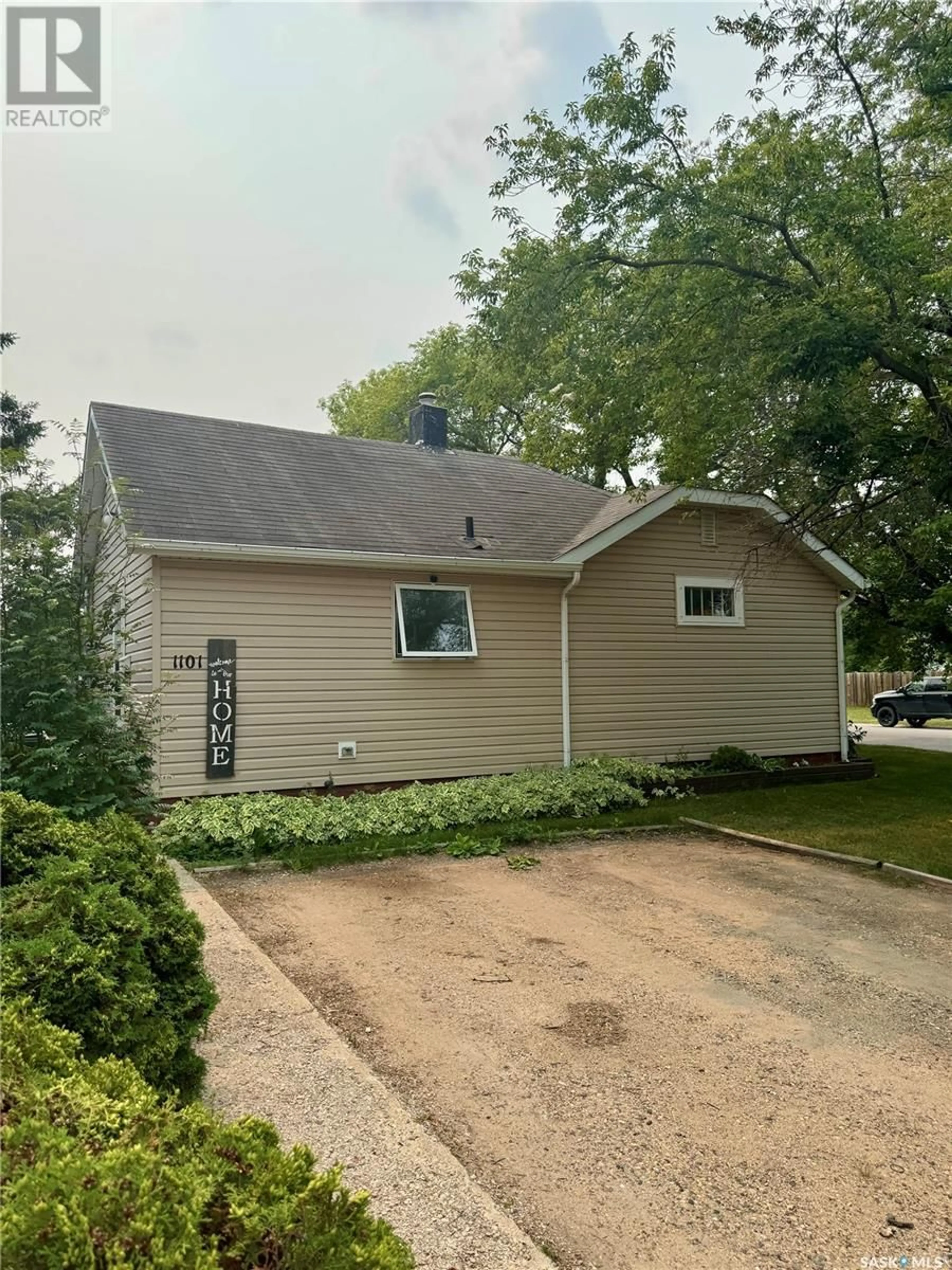 Home with vinyl exterior material, street for 1101 2ND STREET, Prince Albert Saskatchewan S6V0G9