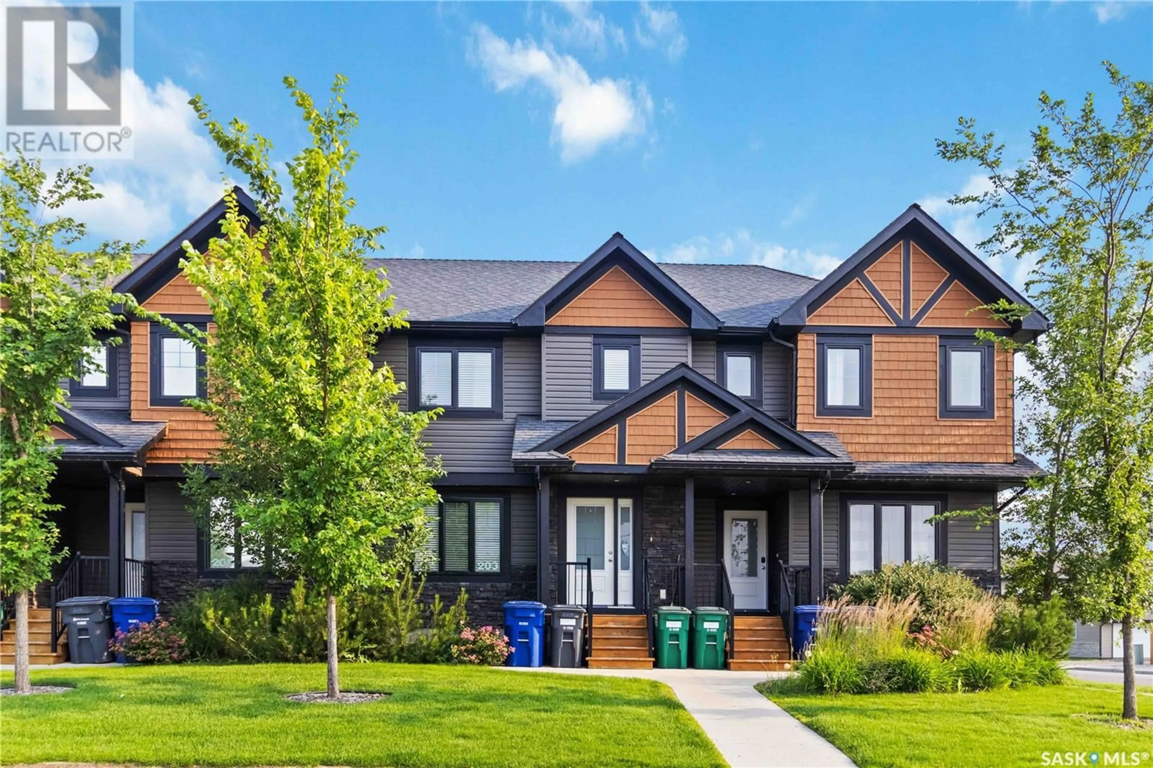 Home with brick exterior material, street for 203 RAJPUT WAY, Saskatoon Saskatchewan S7W0T7