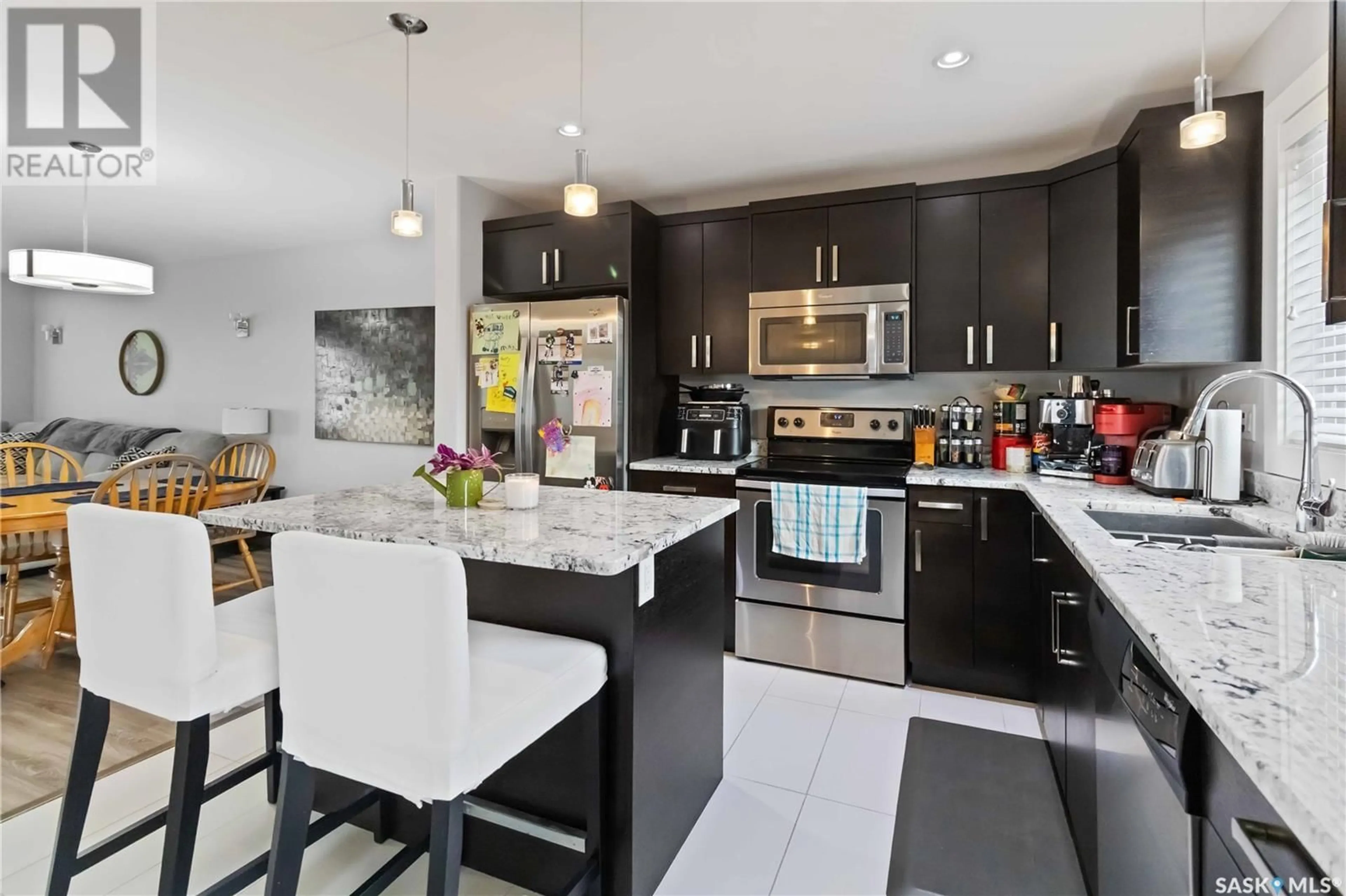 Open concept kitchen, ceramic/tile floor for 203 RAJPUT WAY, Saskatoon Saskatchewan S7W0T7