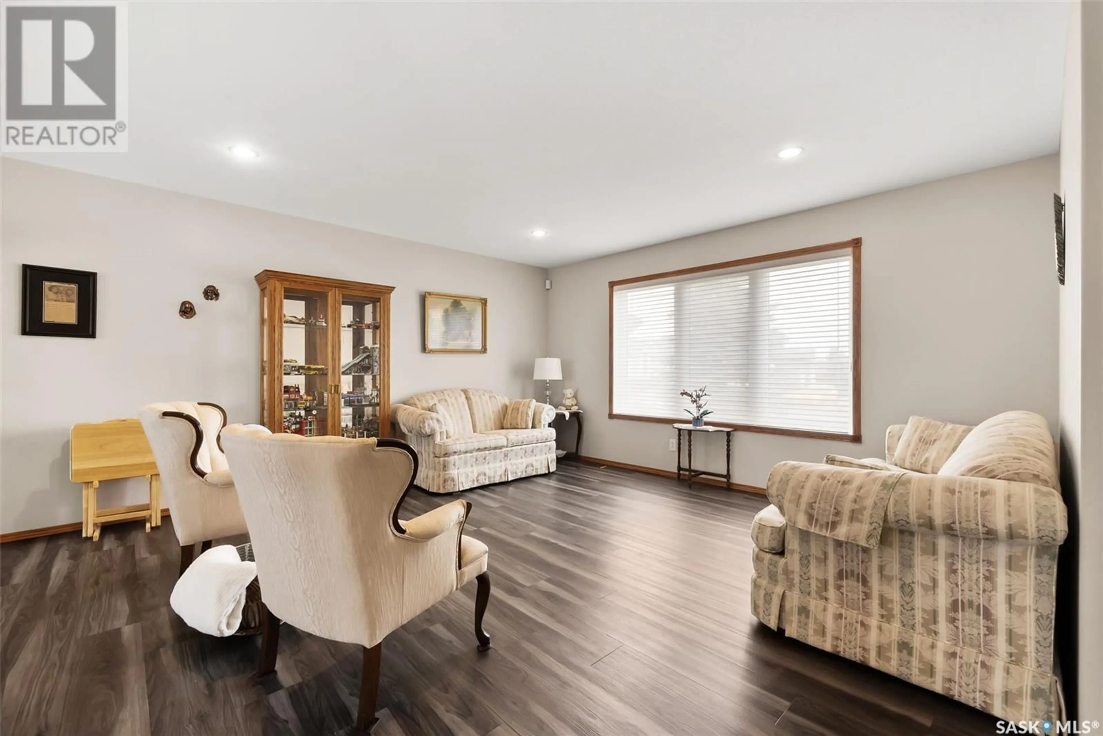 Living room with furniture, wood/laminate floor for 1510 LAKERIDGE DRIVE, Regina Saskatchewan S4X4L5