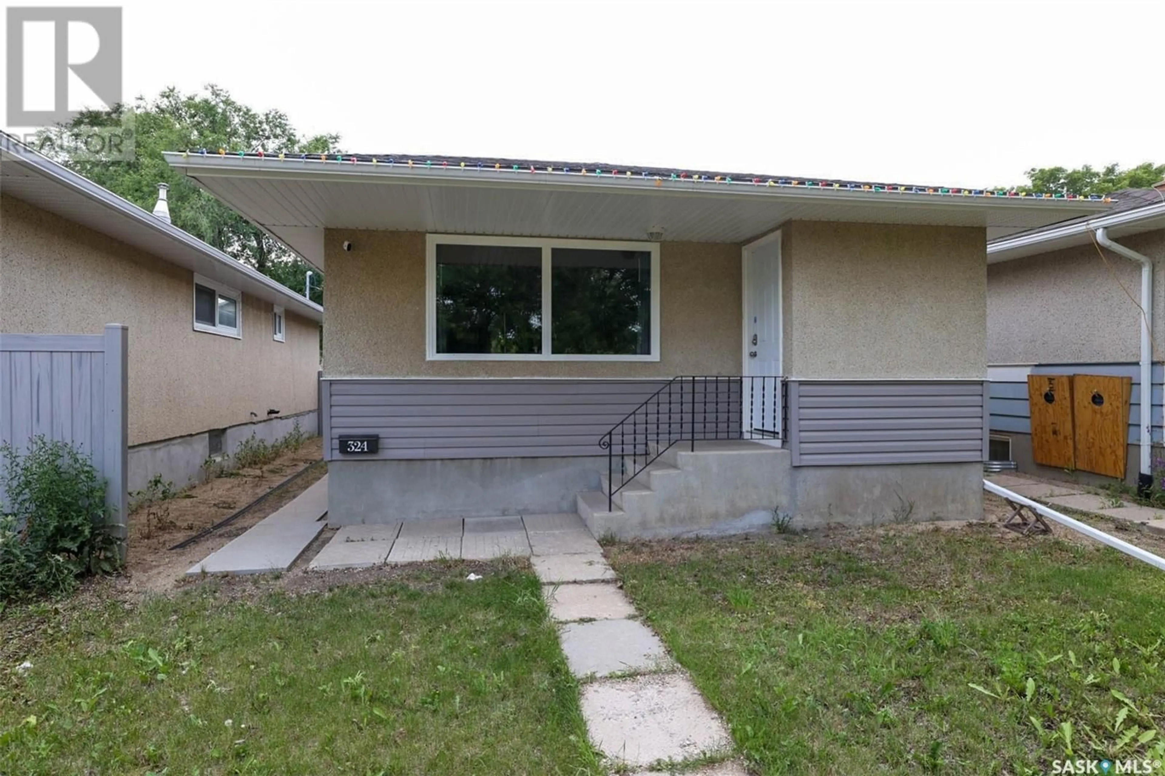 Home with vinyl exterior material, street for 324 ST JOHN STREET, Regina Saskatchewan S4R1R2