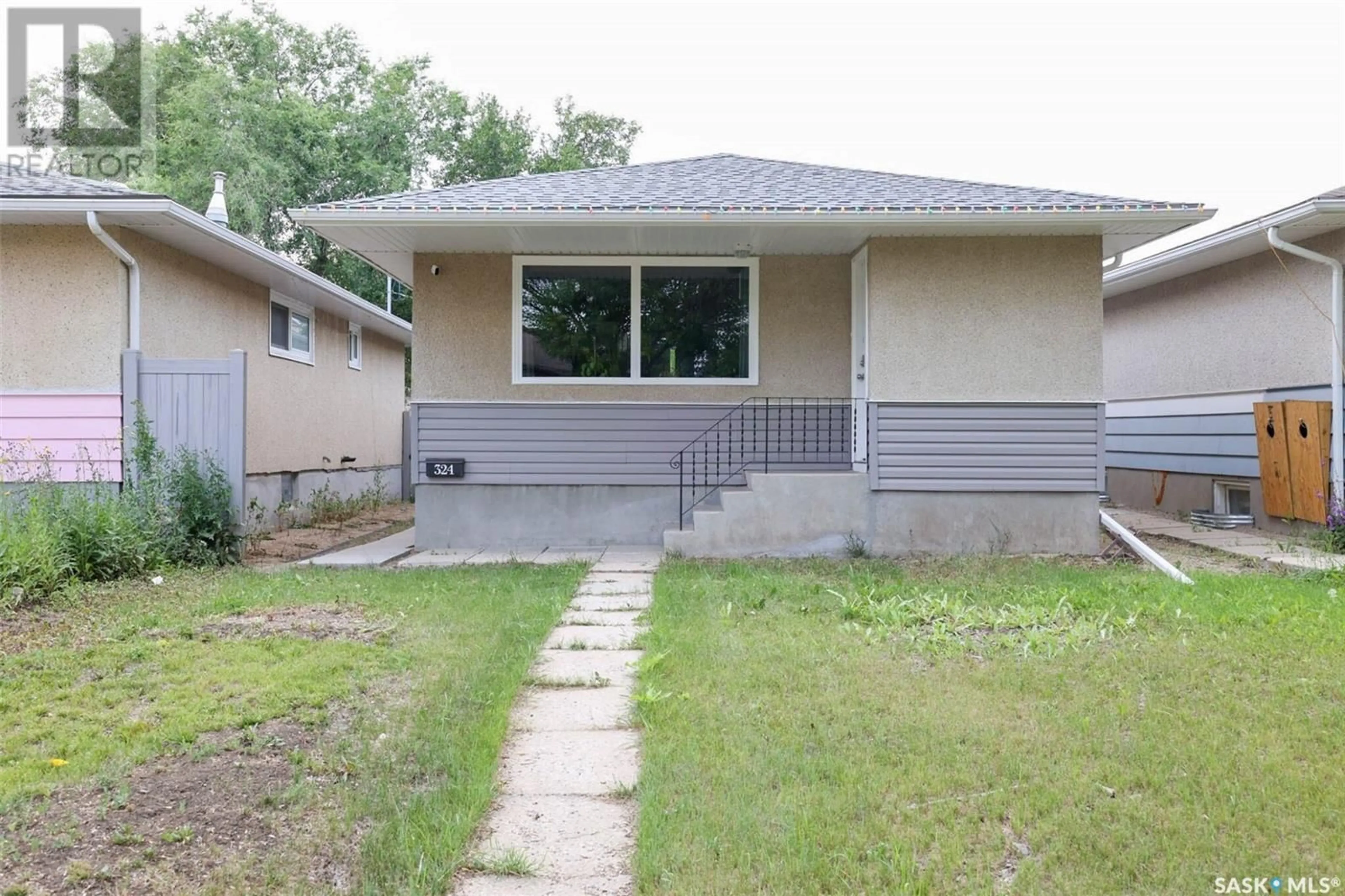 Home with vinyl exterior material, street for 324 ST JOHN STREET, Regina Saskatchewan S4R1R2
