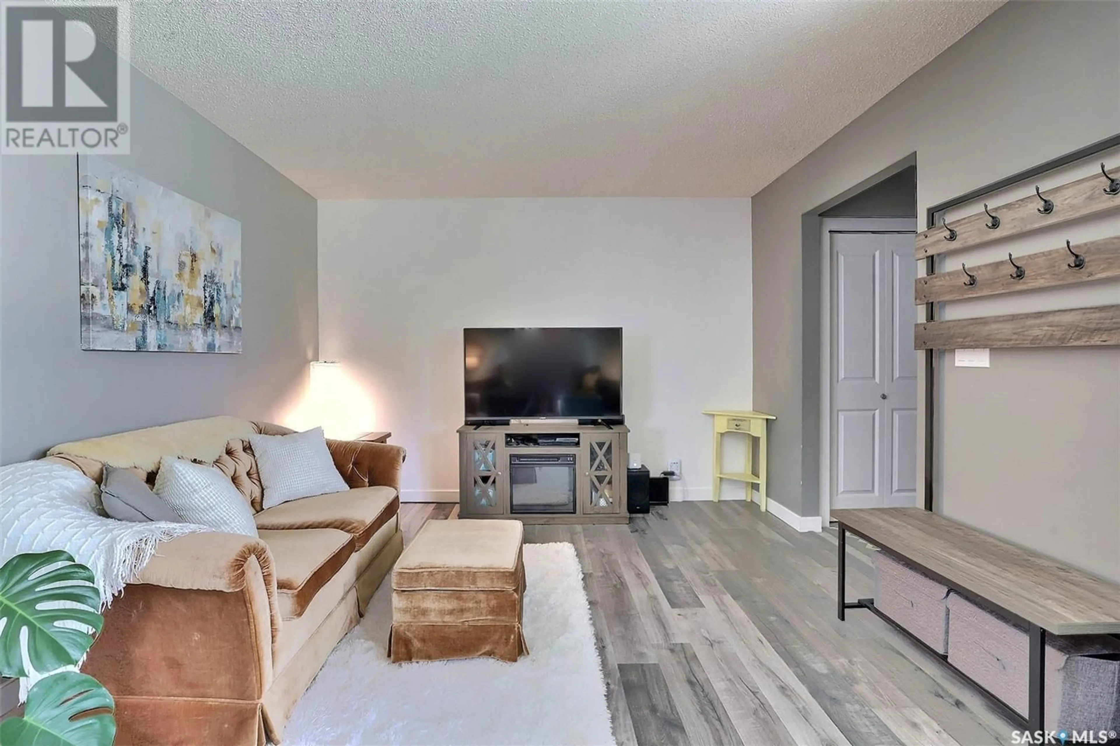 Living room with furniture, wood/laminate floor for 324 ST JOHN STREET, Regina Saskatchewan S4R1R2