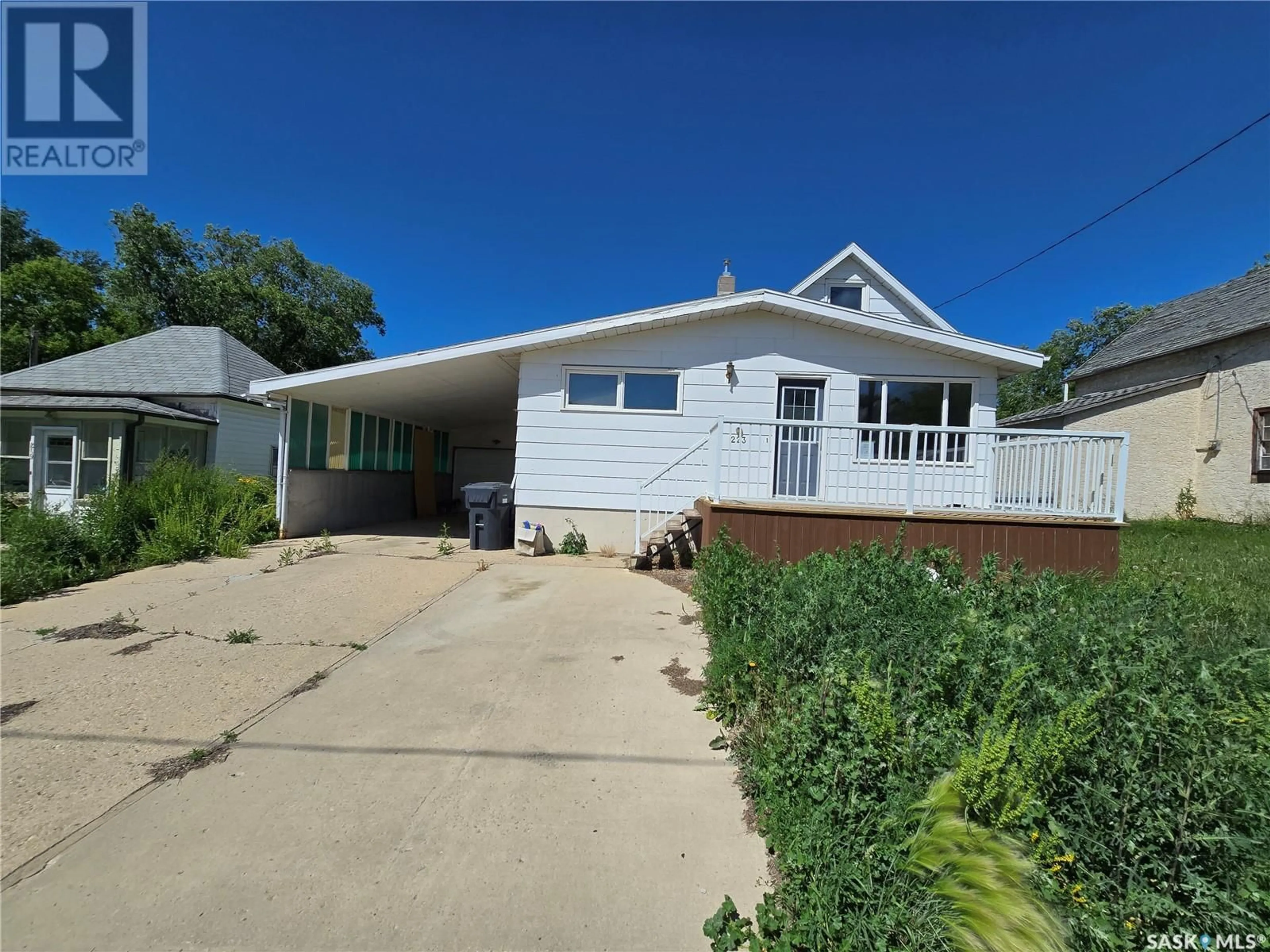 Home with vinyl exterior material, street for 223 MERGENS STREET, Weyburn Saskatchewan S4H1R4