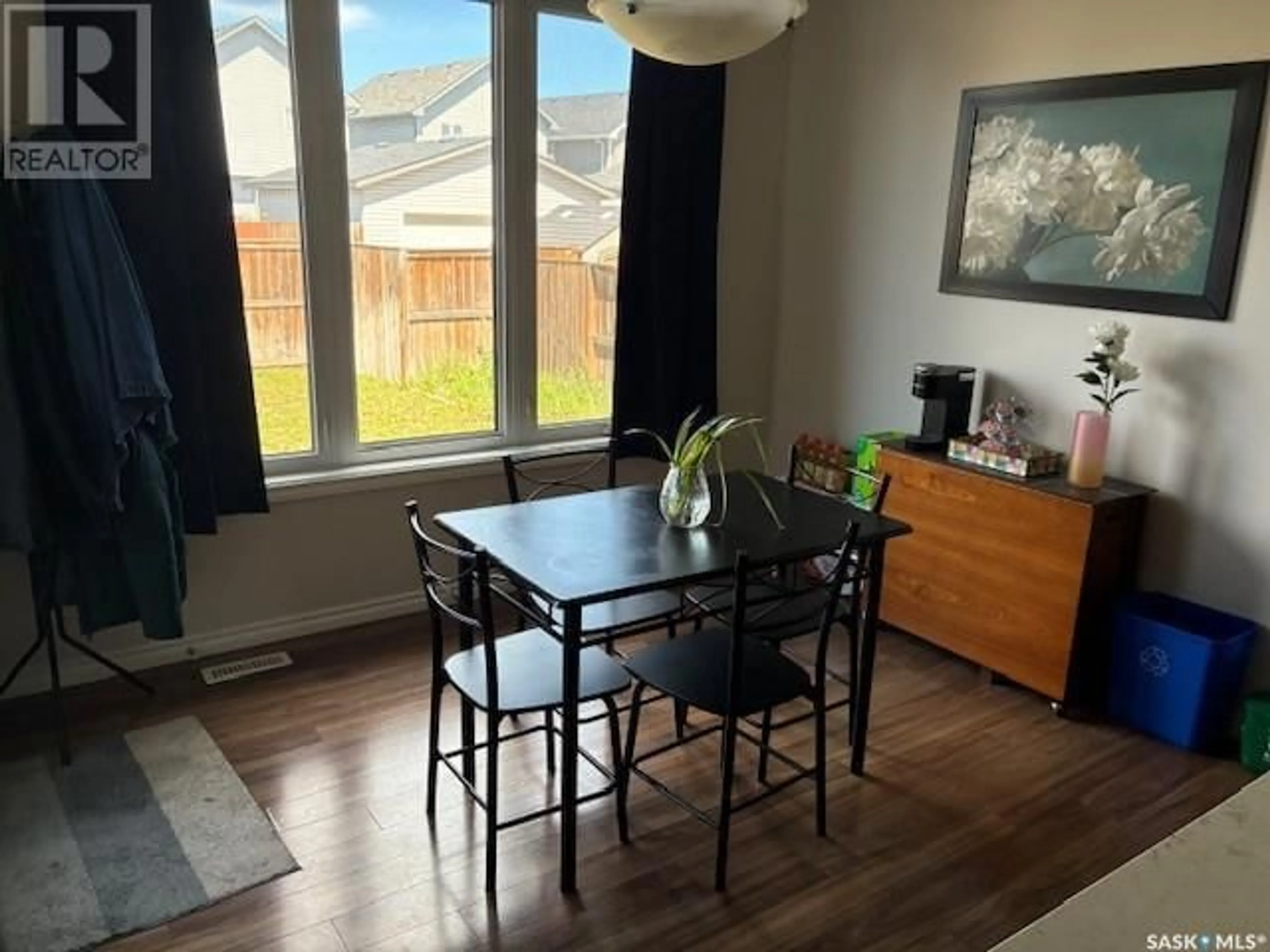 Dining room, wood/laminate floor for 411 LANGLOIS WAY, Saskatoon Saskatchewan S7T0M9