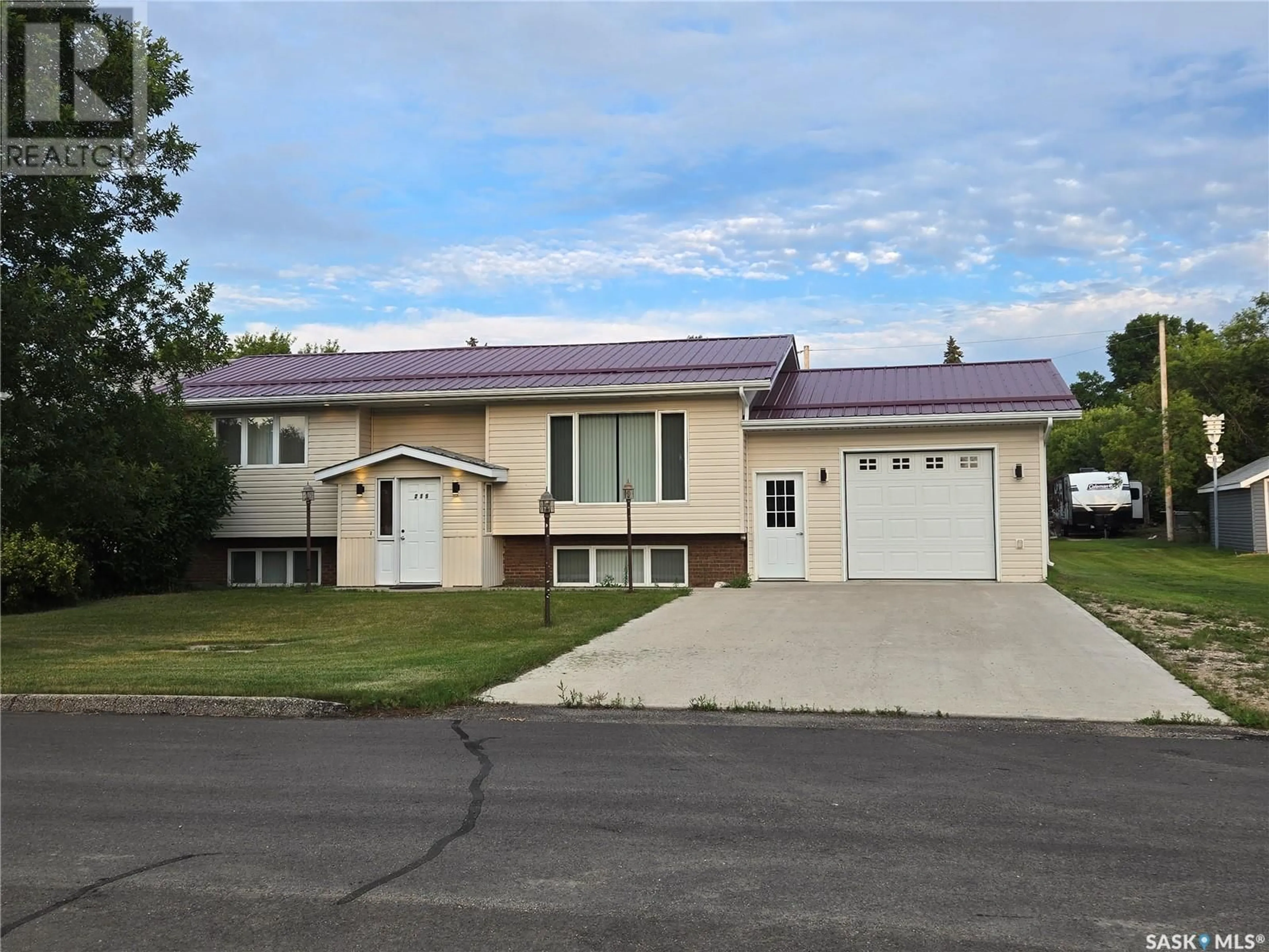 Home with vinyl exterior material, street for 215 HEWARD STREET, Stoughton Saskatchewan S0G4T0