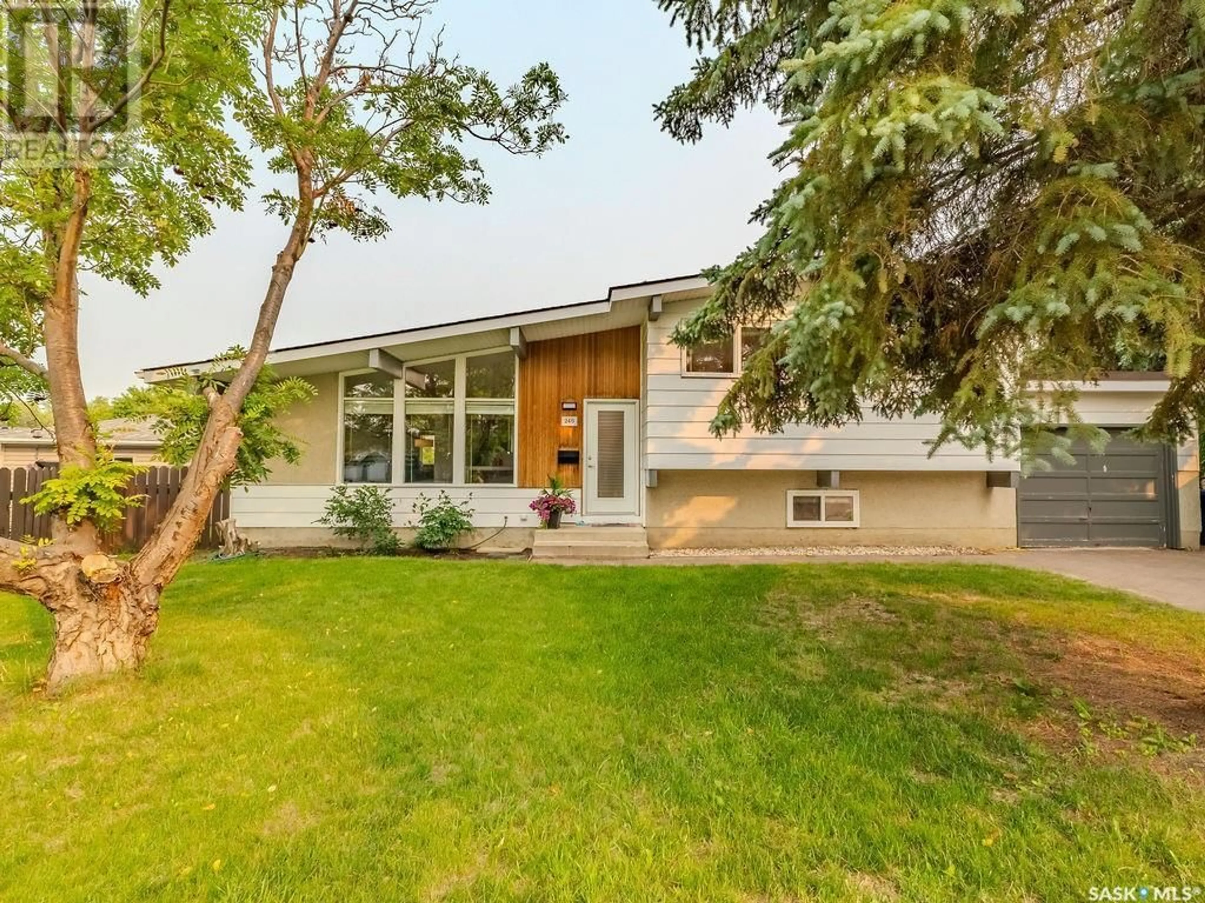 Home with vinyl exterior material, street for 246 ANDERSON CRESCENT, Saskatoon Saskatchewan S7H4C2