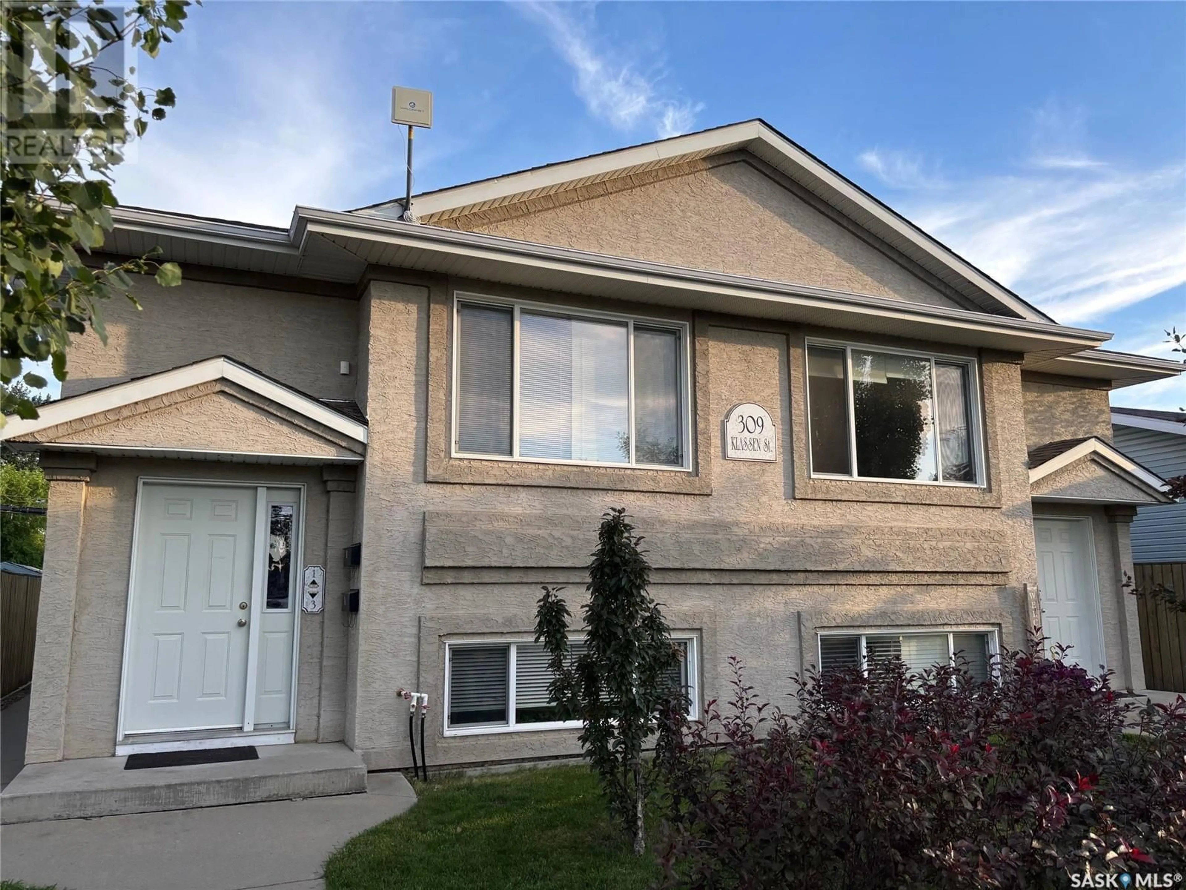 Home with vinyl exterior material, street for 309 KLASSEN STREET, Warman Saskatchewan S0K4S0