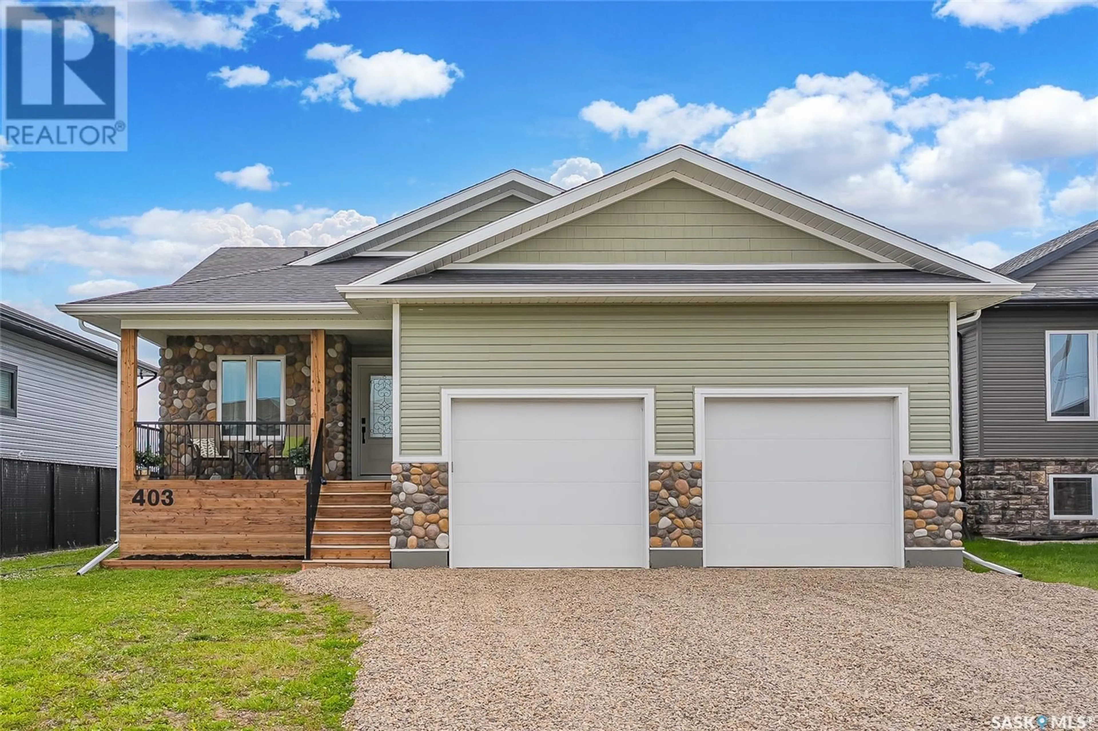 Home with vinyl exterior material, street for 403 LOEPPKY AVENUE, Dalmeny Saskatchewan S0K1E0