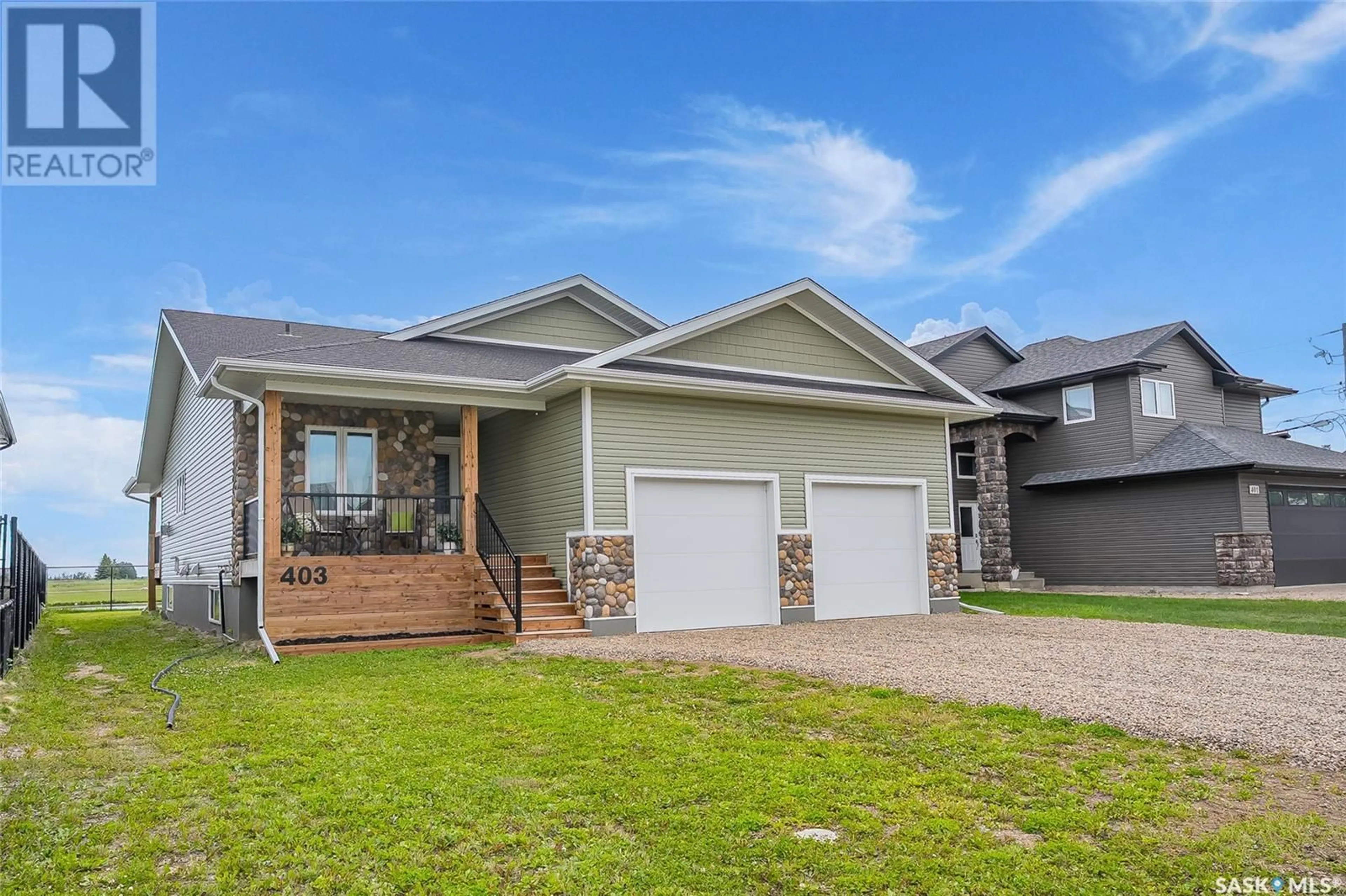 Home with vinyl exterior material, street for 403 LOEPPKY AVENUE, Dalmeny Saskatchewan S0K1E0