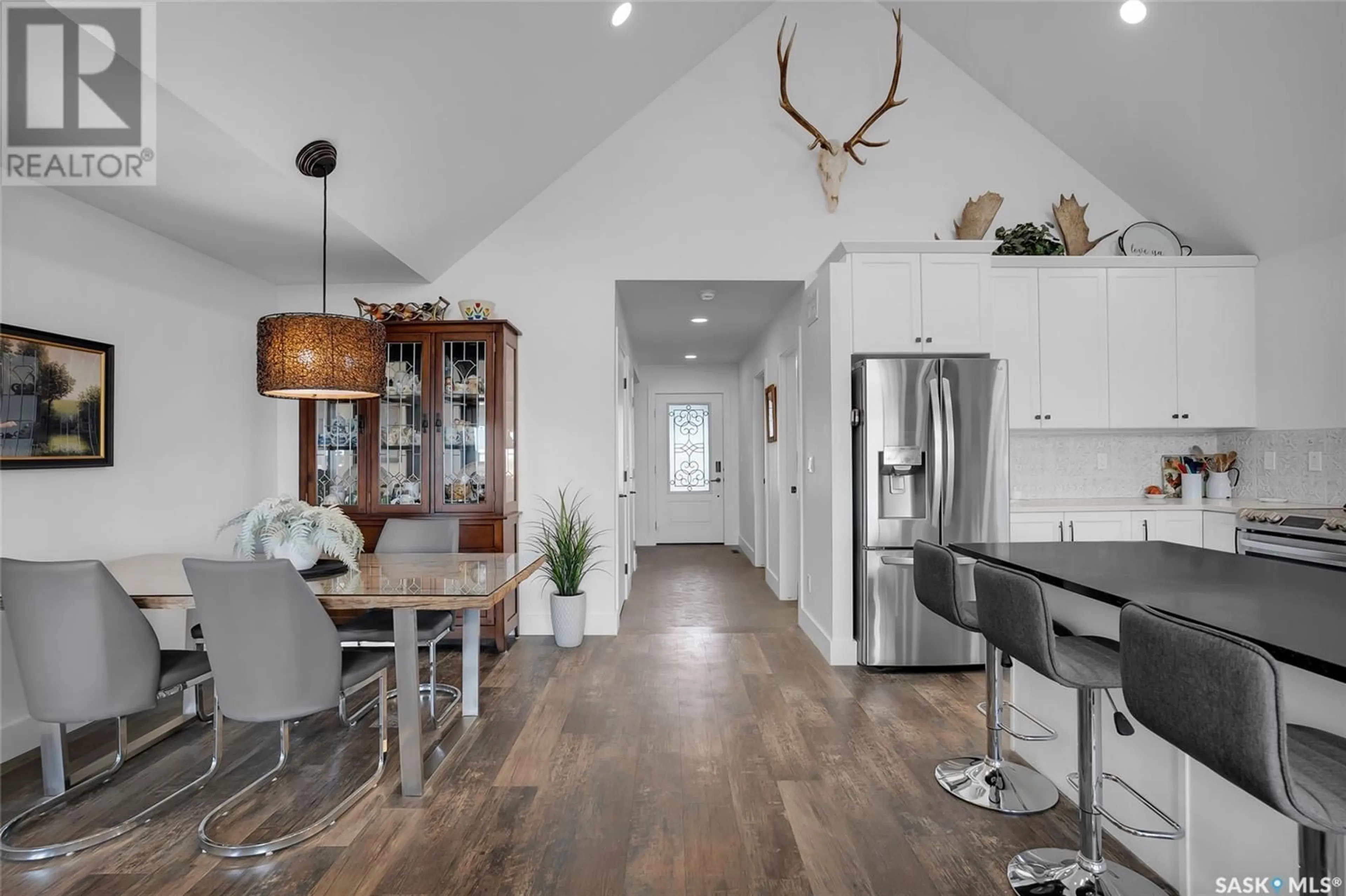 Open concept kitchen, wood/laminate floor for 403 LOEPPKY AVENUE, Dalmeny Saskatchewan S0K1E0