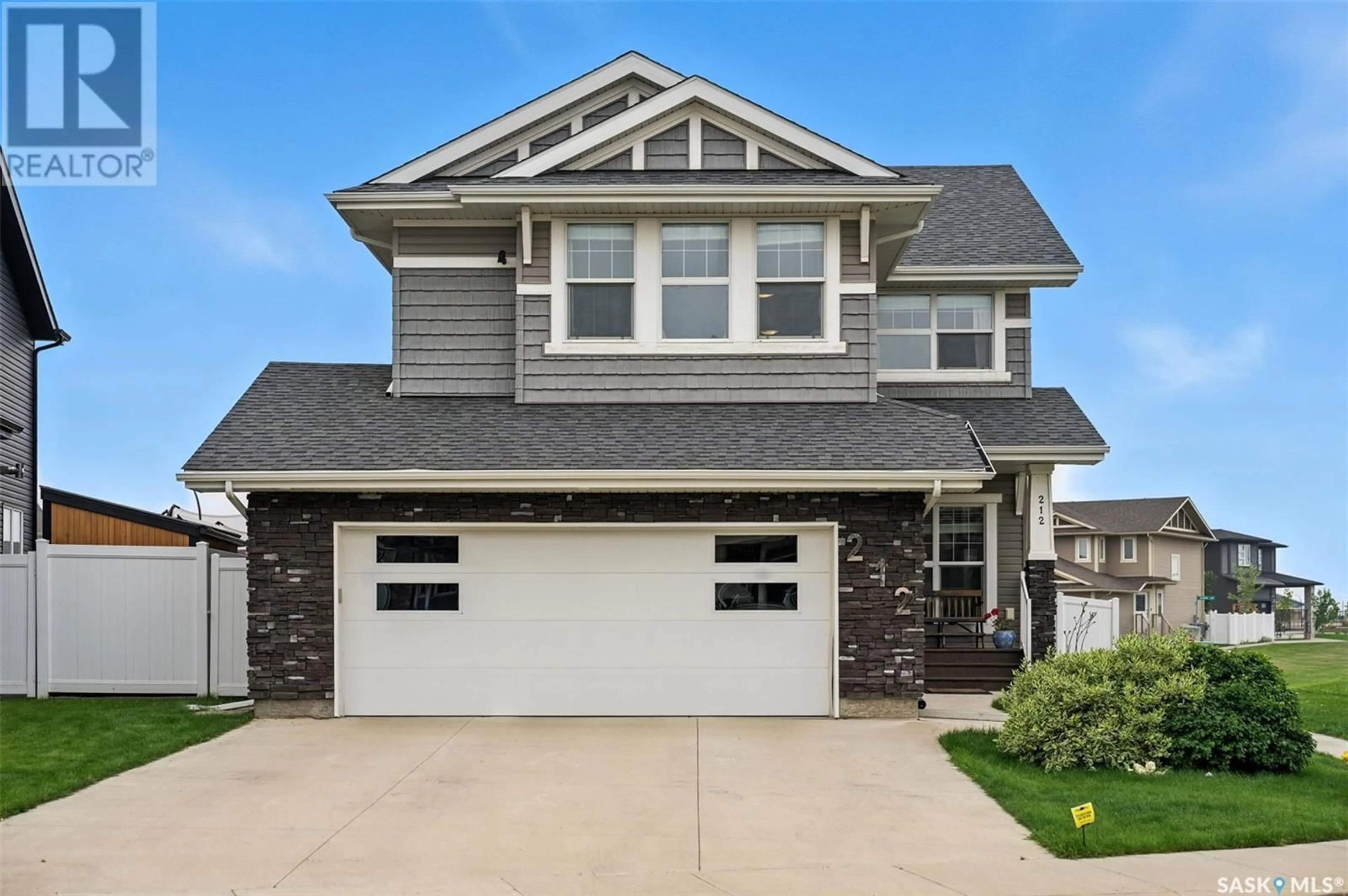 Home with vinyl exterior material, street for 212 SECORD WAY, Saskatoon Saskatchewan S7V0L9