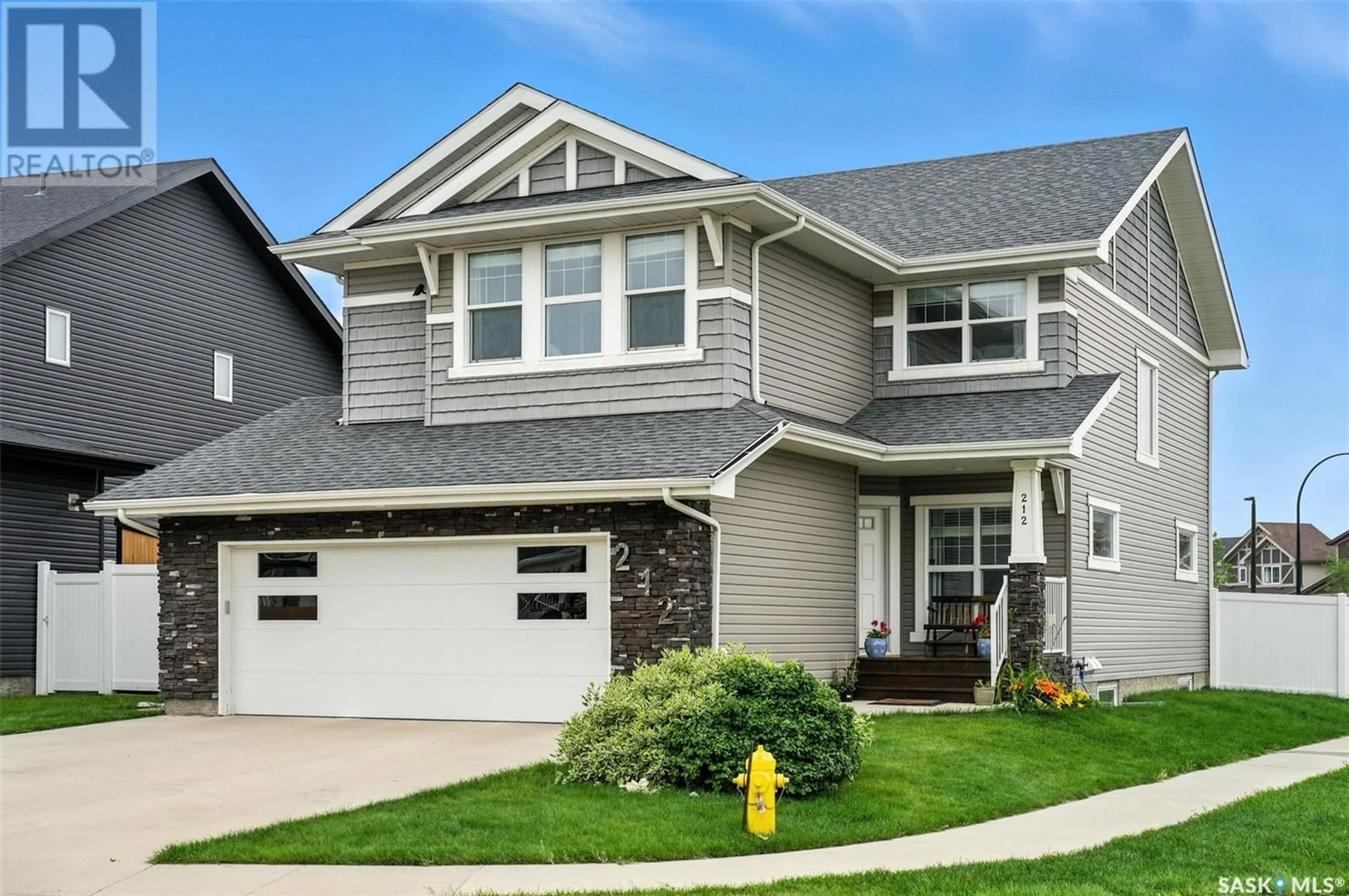 Home with vinyl exterior material, street for 212 SECORD WAY, Saskatoon Saskatchewan S7V0L9