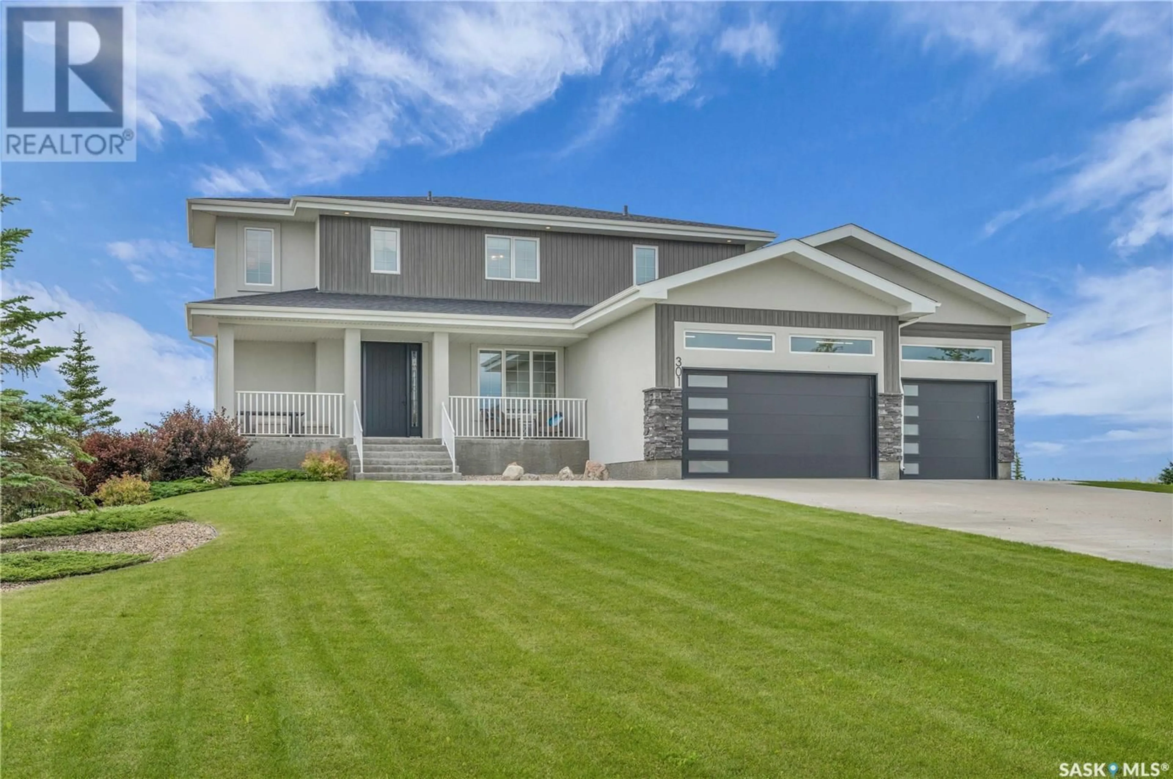 Home with vinyl exterior material, street for 301 SPRUCE CREEK CRESCENT, Pilot Butte Saskatchewan S4L5B1