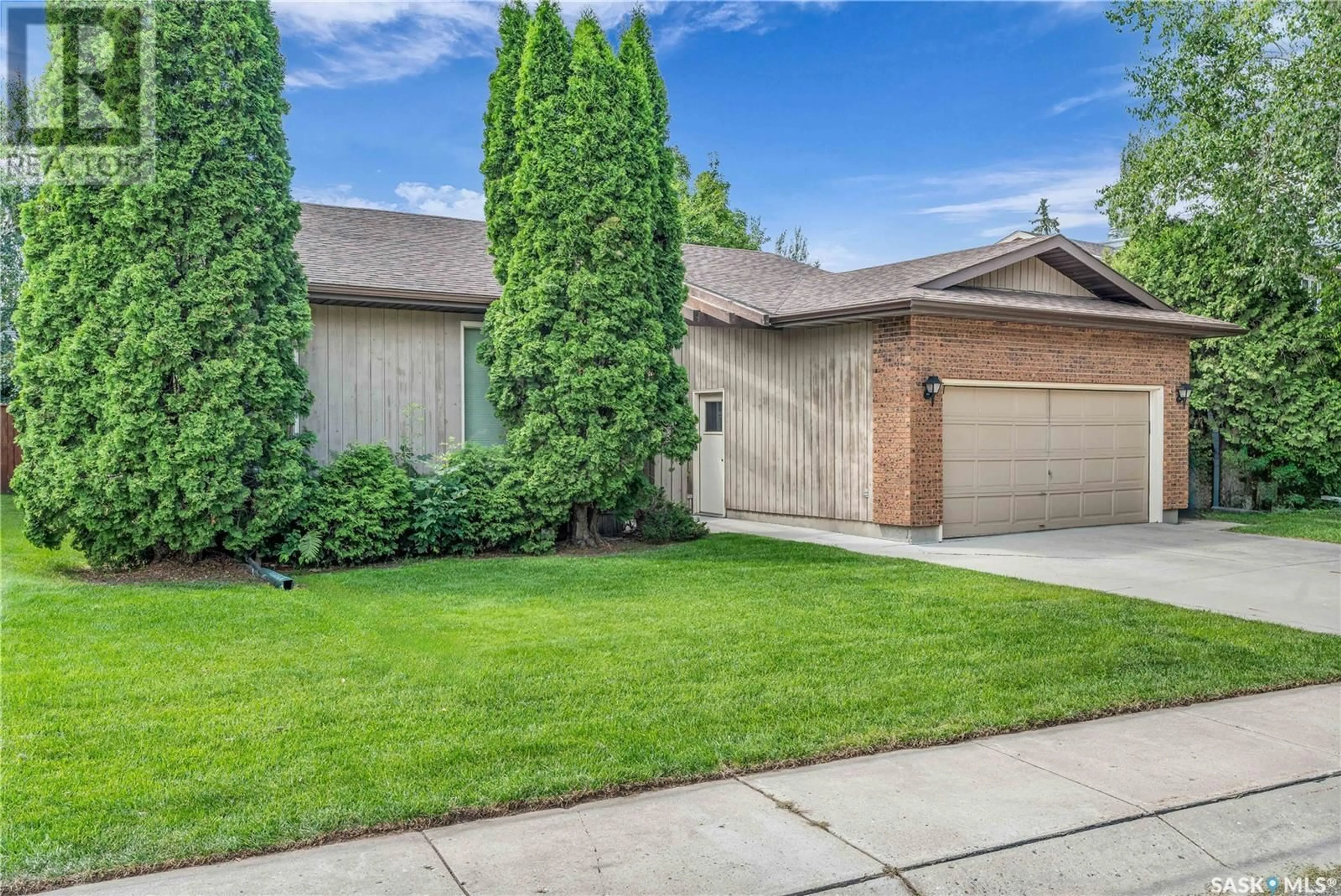 Home with brick exterior material, street for 606 WHITEWOOD WAY, Saskatoon Saskatchewan S7J4L6