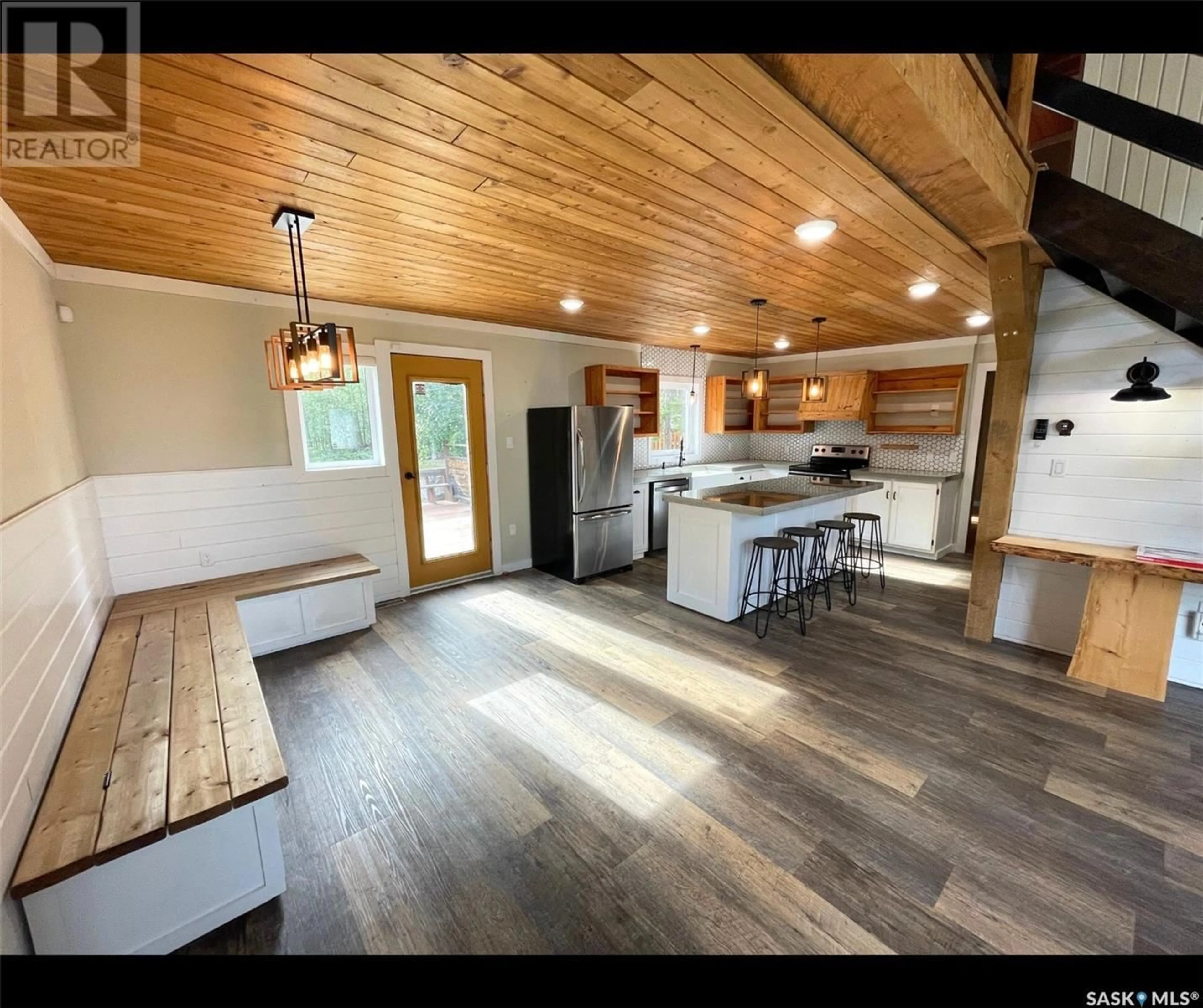 Open concept kitchen, wood/laminate floor for 247 DEHAVILLAND AVENUE, Air Ronge Saskatchewan S0J3G0