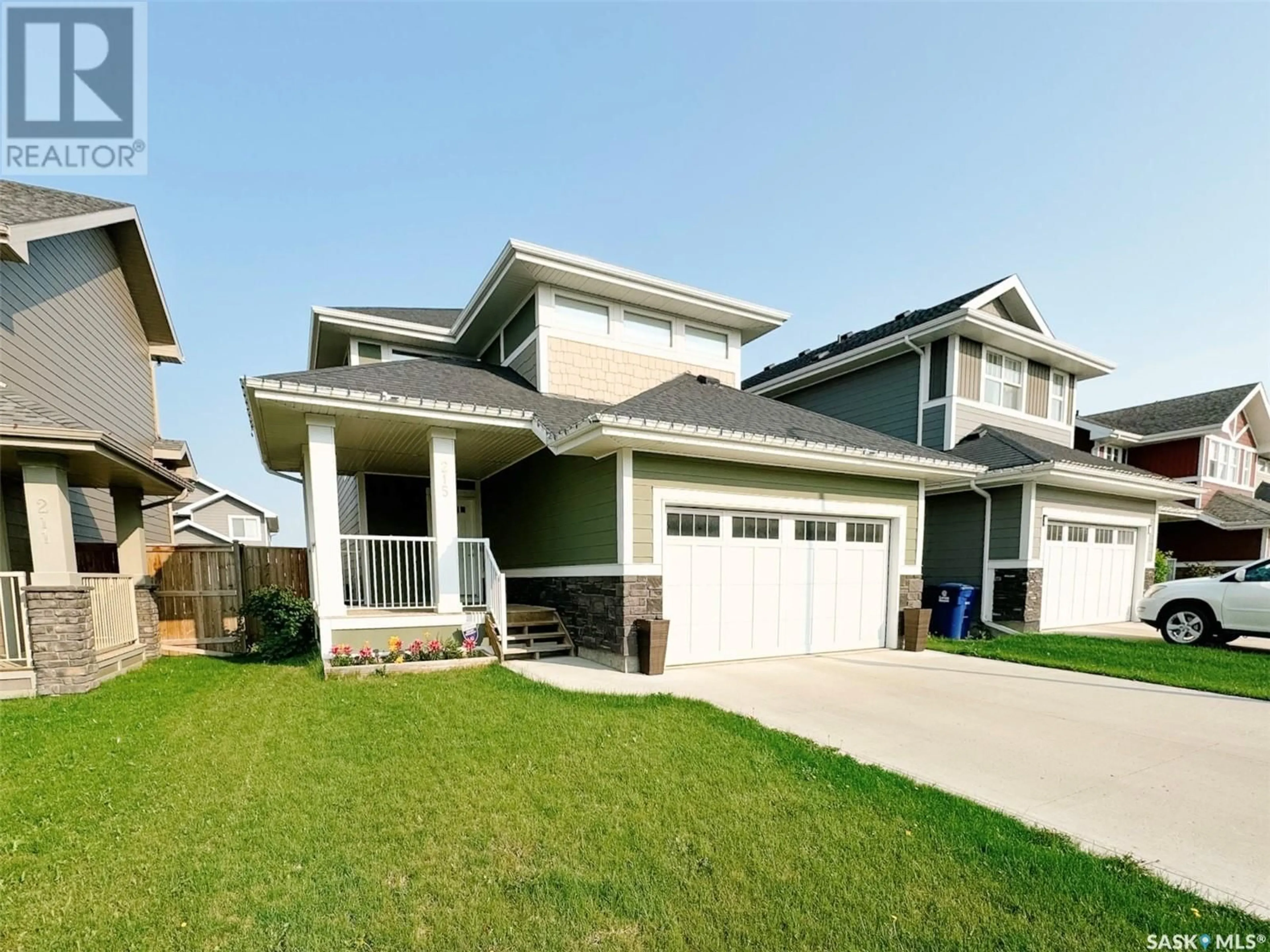 Home with vinyl exterior material, street for 215 EATON CRESCENT, Saskatoon Saskatchewan S7V0H4