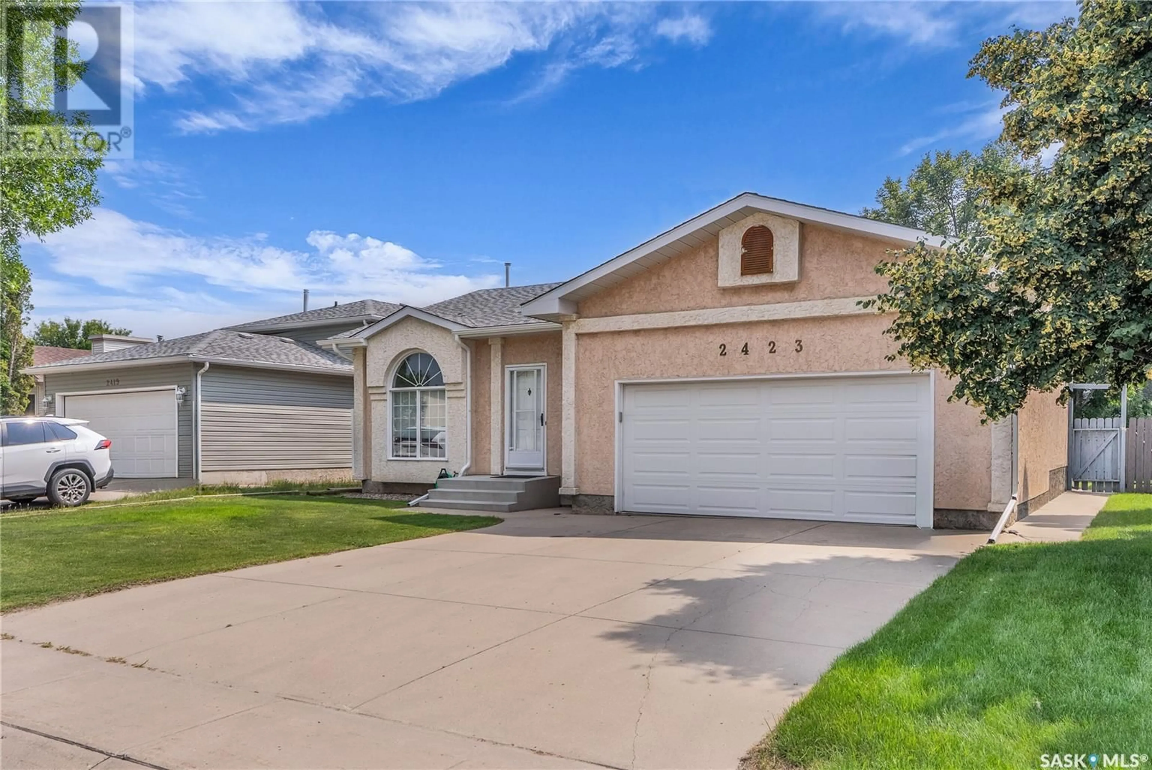 Home with vinyl exterior material, street for 2423 KENDERDINE ROAD, Saskatoon Saskatchewan S7N4A4