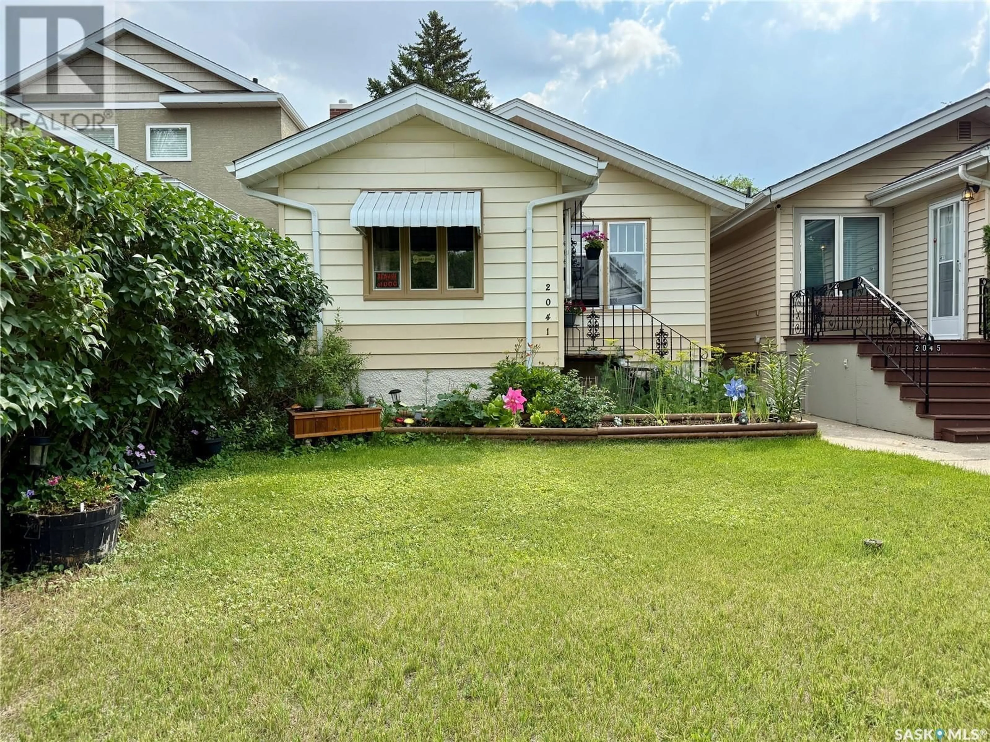 Home with vinyl exterior material, street for 2041 MCTAVISH STREET, Regina Saskatchewan S4T3W8