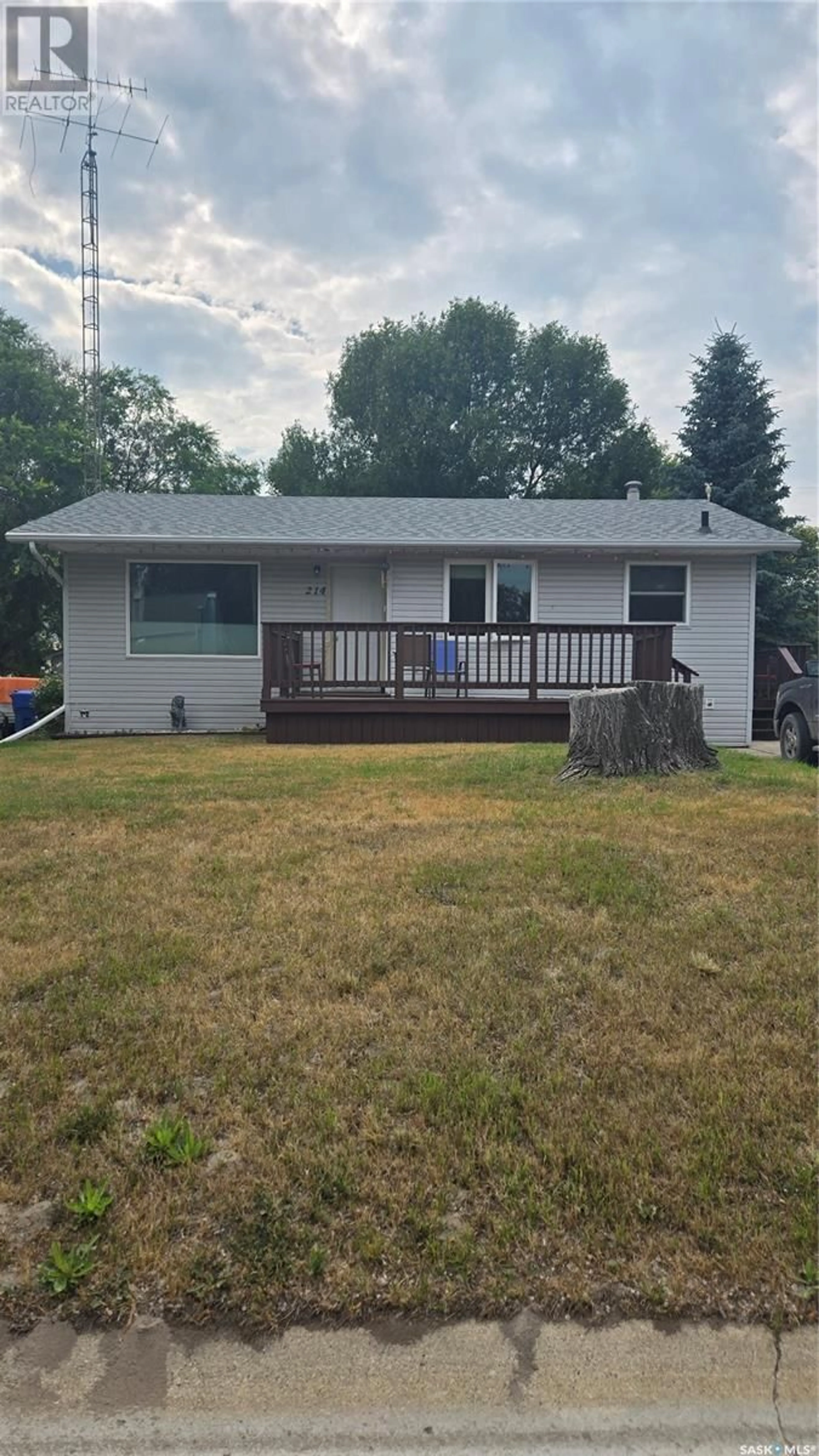 Home with vinyl exterior material, street for 214 3RD STREET, Carnduff Saskatchewan S0C0S0