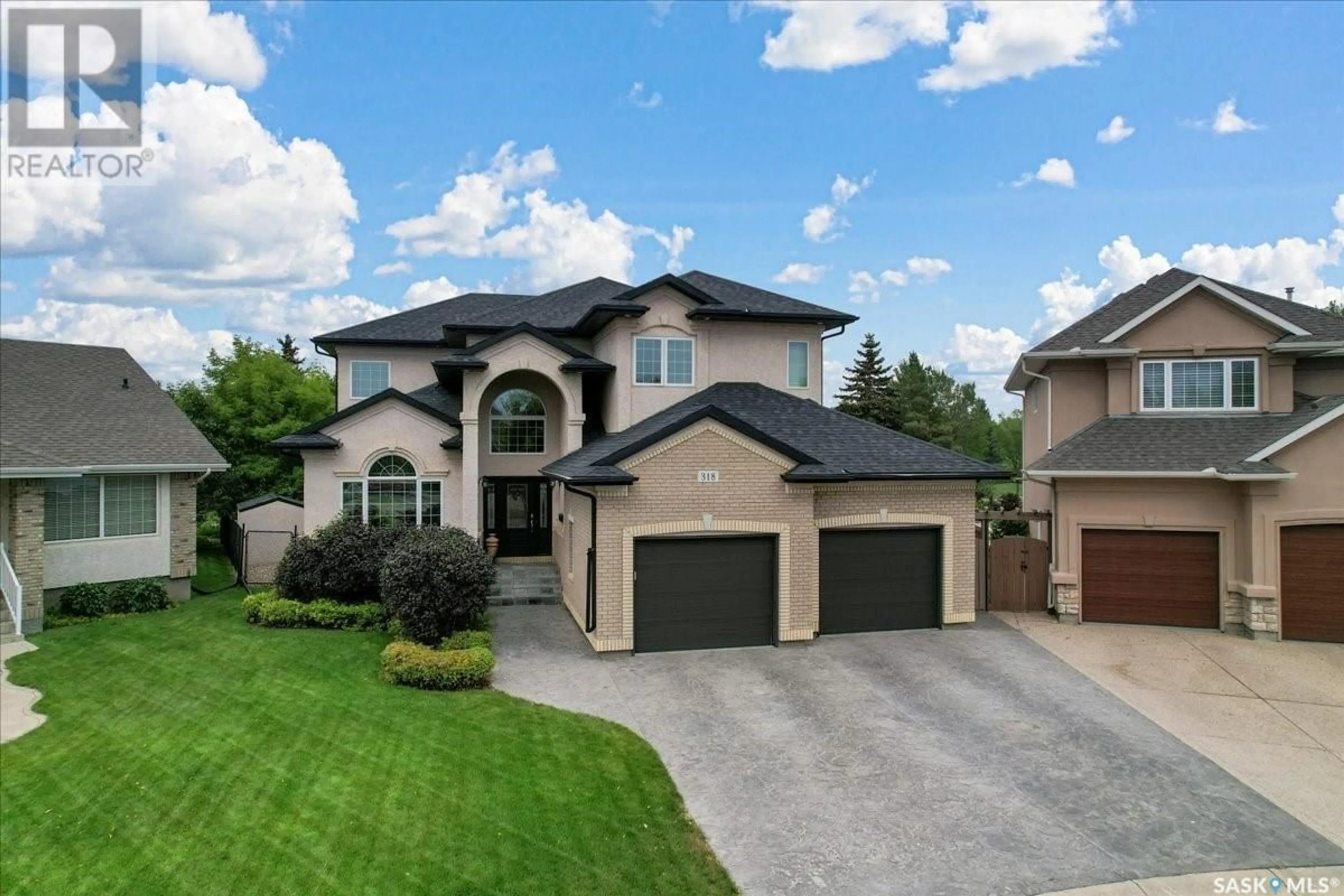 A pic from outside/outdoor area/front of a property/back of a property/a pic from drone, street for 318 WRIGHT COURT, Saskatoon Saskatchewan S7N4T6