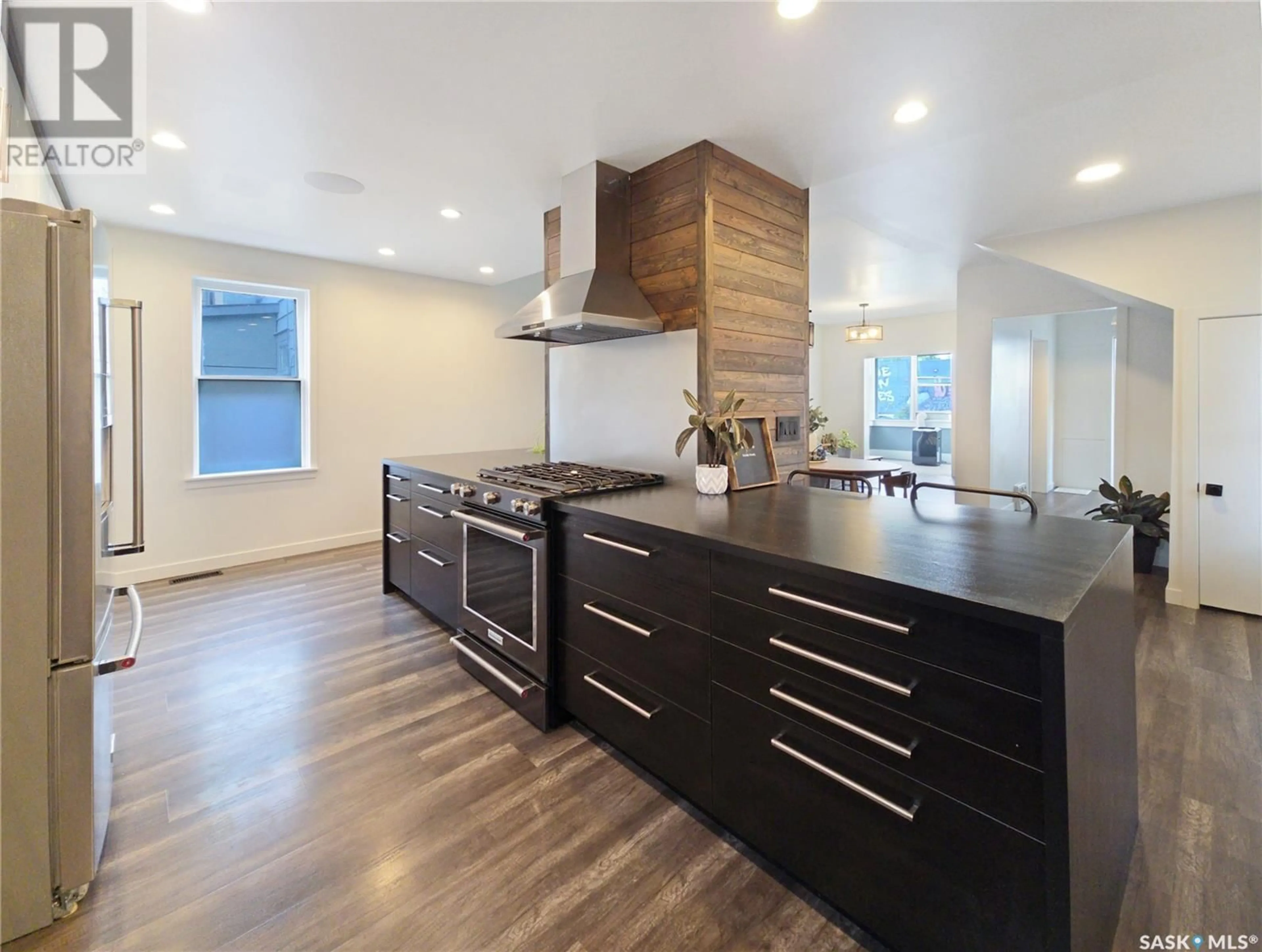 Open concept kitchen, wood/laminate floor for 227 H AVENUE, Saskatoon Saskatchewan S7M1W1