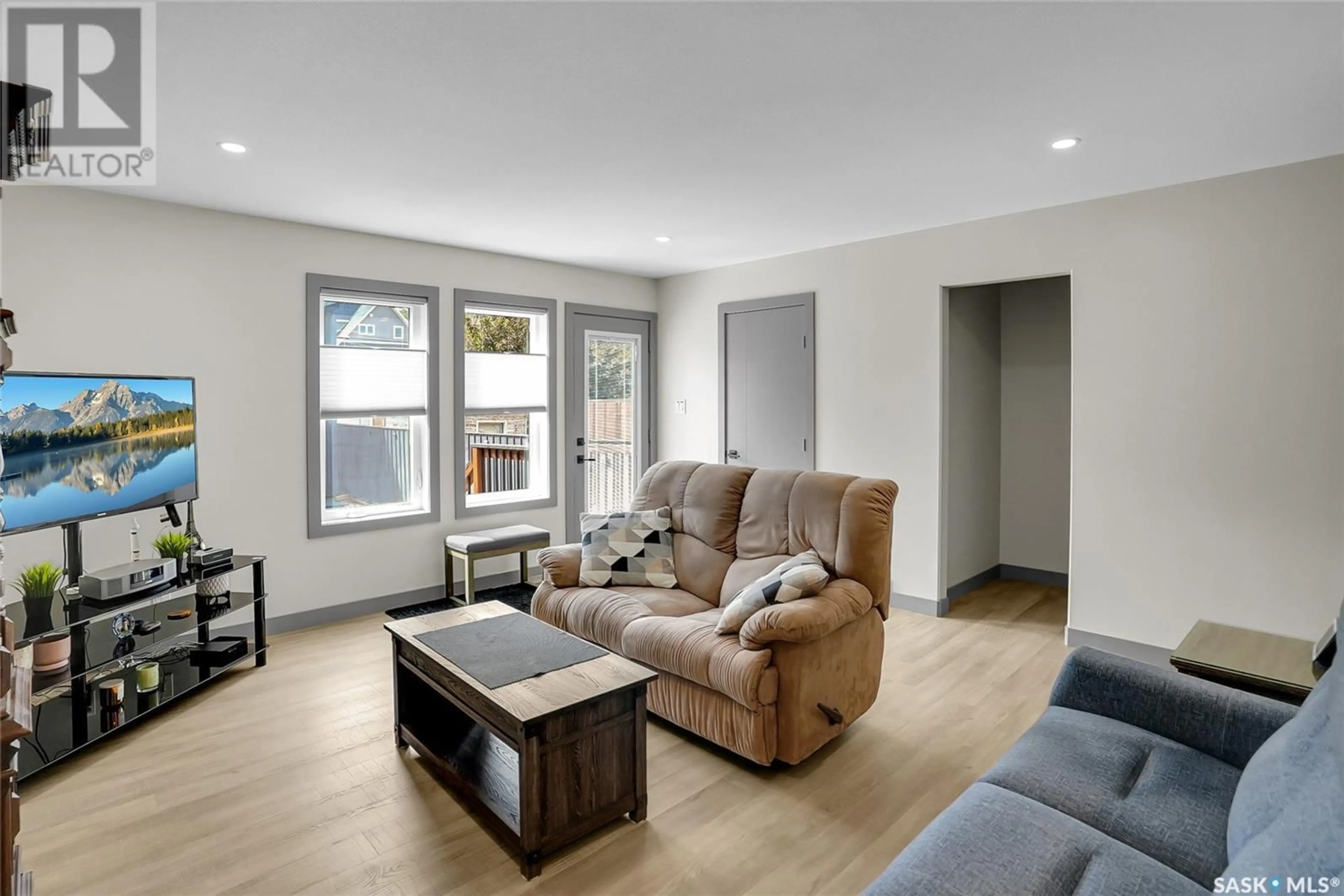 Living room with furniture, wood/laminate floor for 1164 WILLOW AVENUE, Moose Jaw Saskatchewan S6H1G8