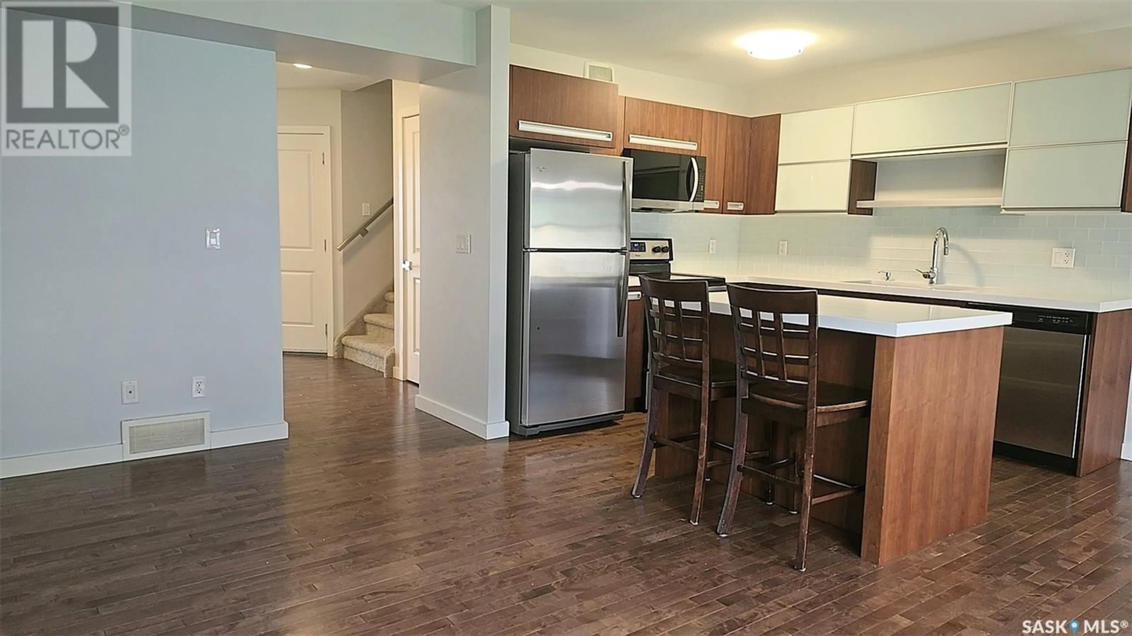Open concept kitchen, wood/laminate floor for 502 455 REMPEL LANE, Saskatoon Saskatchewan S7T0R8