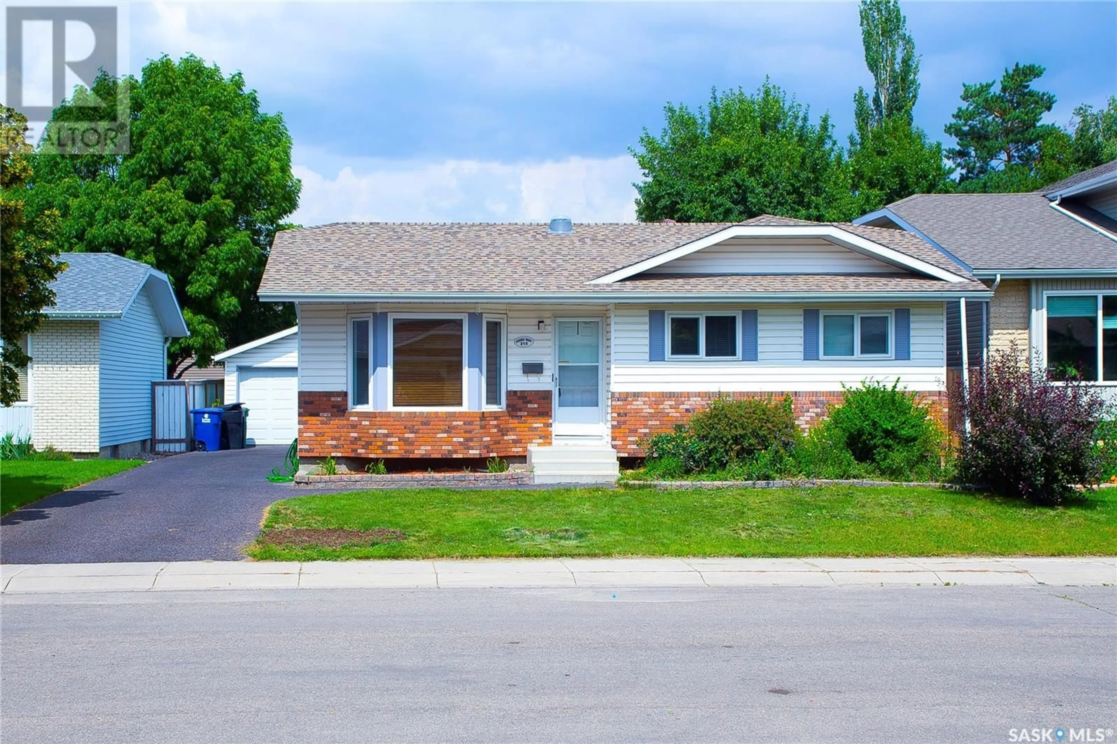 Home with vinyl exterior material, street for 215 HOGG WAY, Saskatoon Saskatchewan S7N3W4