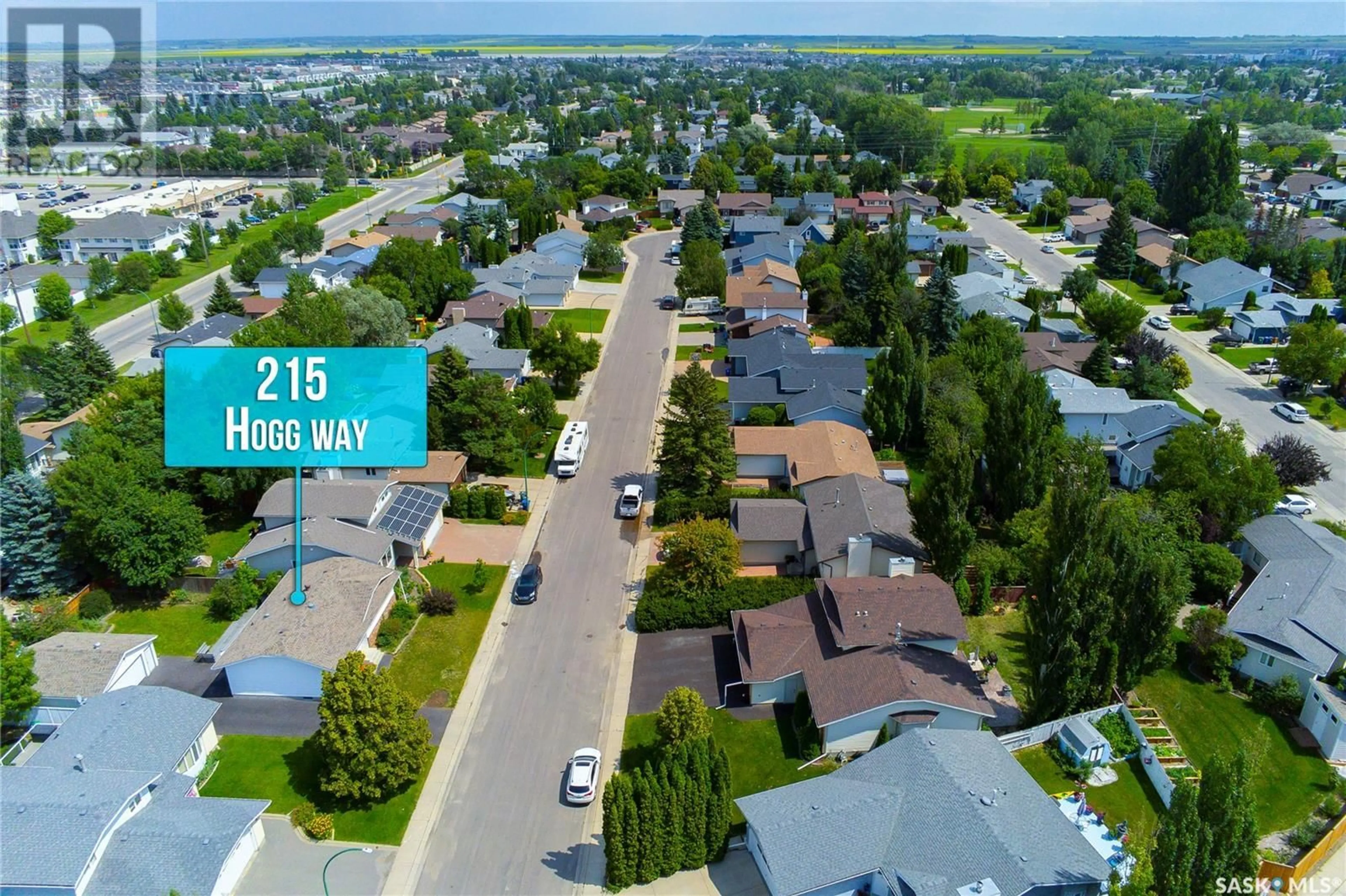 A pic from outside/outdoor area/front of a property/back of a property/a pic from drone, street for 215 HOGG WAY, Saskatoon Saskatchewan S7N3W4
