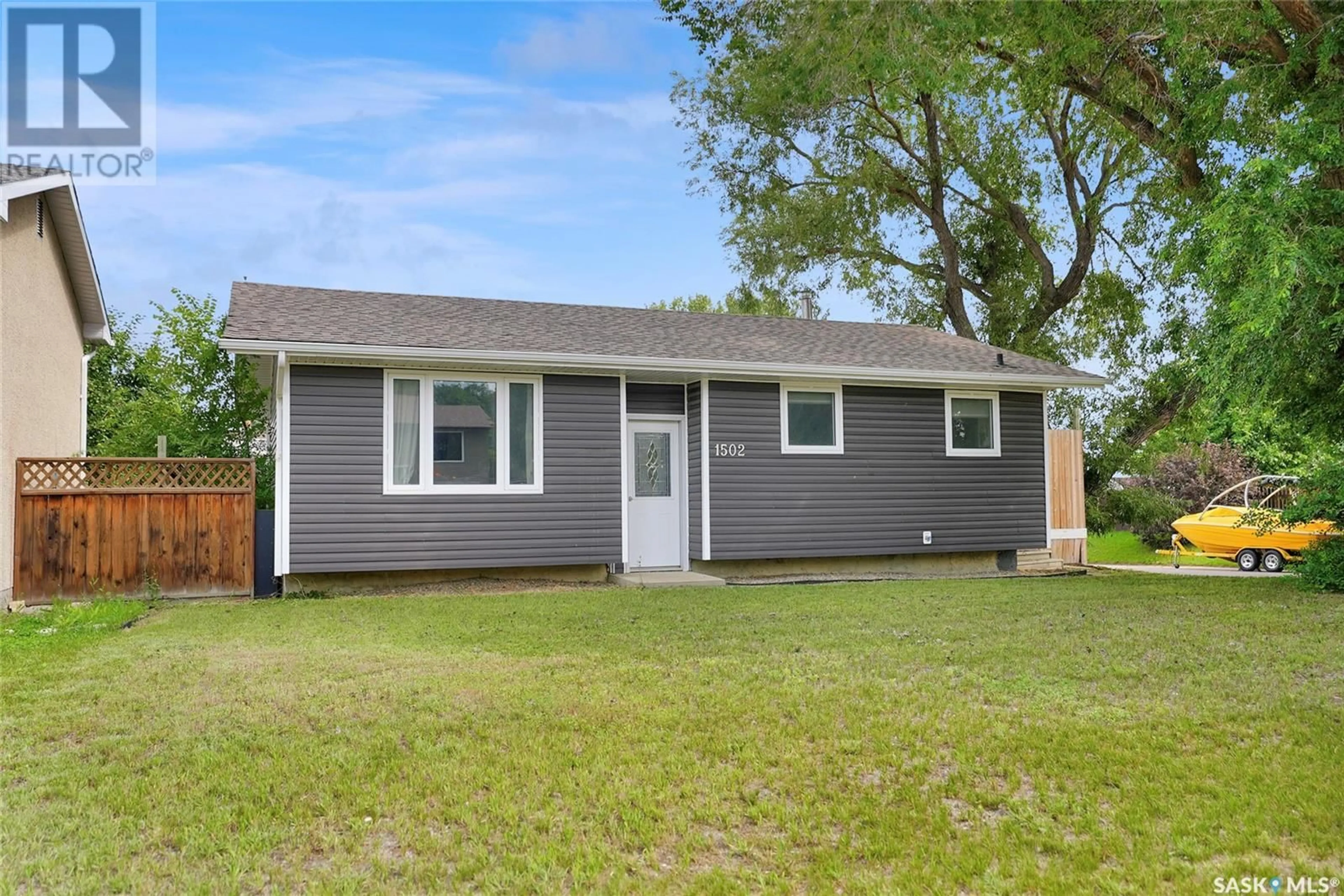 Home with vinyl exterior material, street for 1502 VAUGHAN STREET, Moose Jaw Saskatchewan S6H6S8