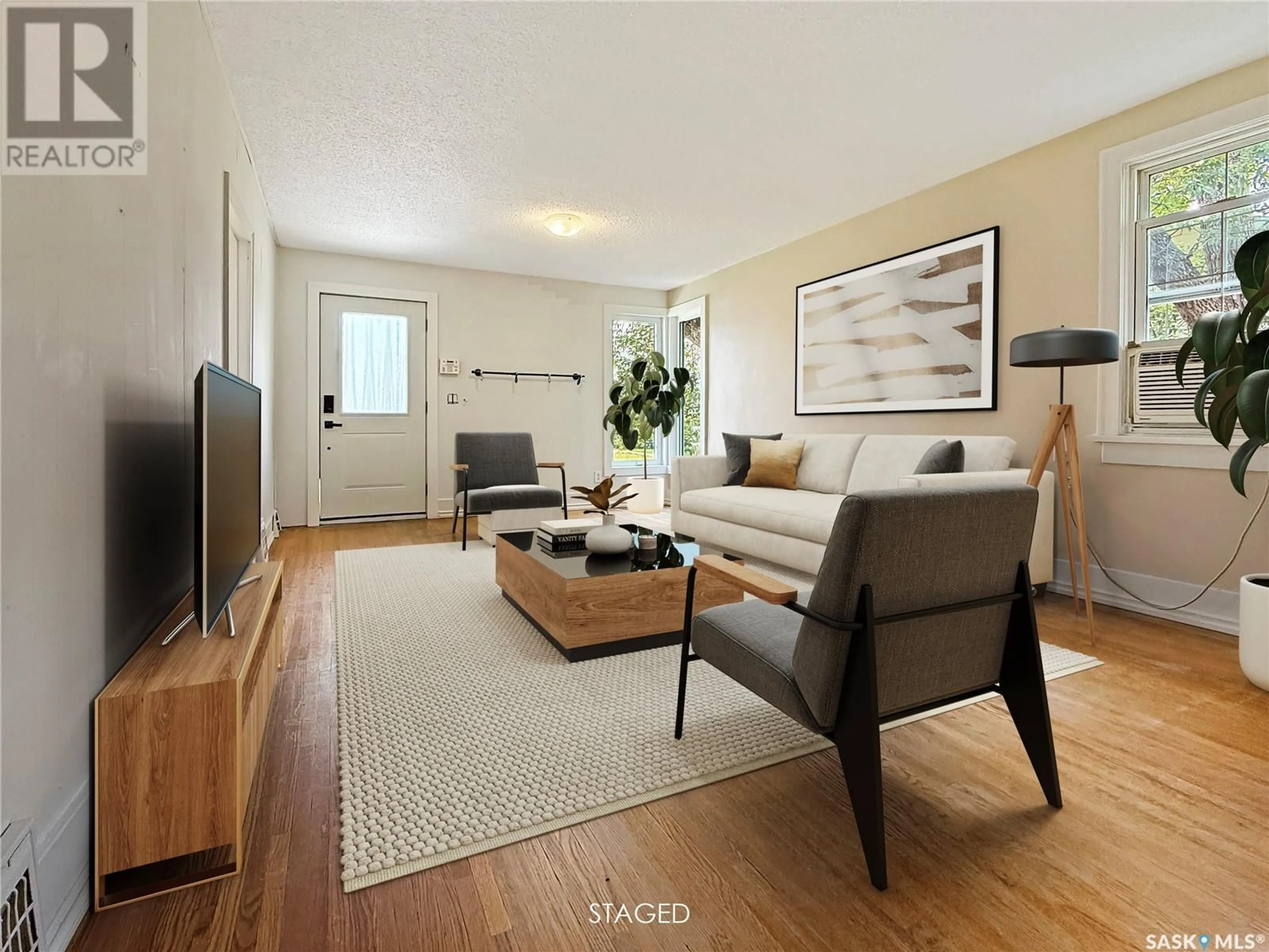Living room with furniture, wood/laminate floor for 352 2ND AVENUE, Swift Current Saskatchewan S9H2E1