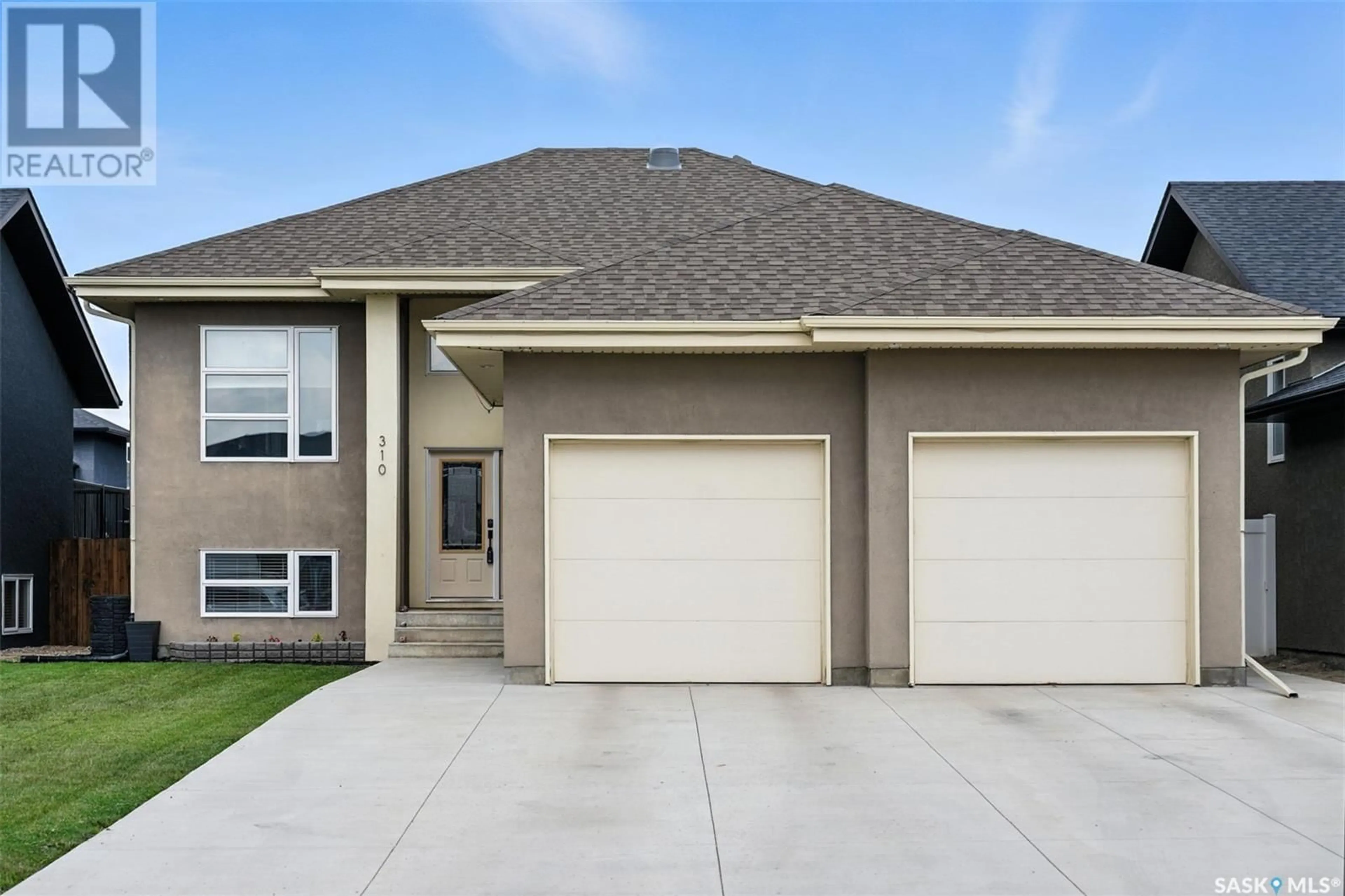 Home with vinyl exterior material, street for 310 AUGUSTA BOULEVARD, Warman Saskatchewan S0K4S1