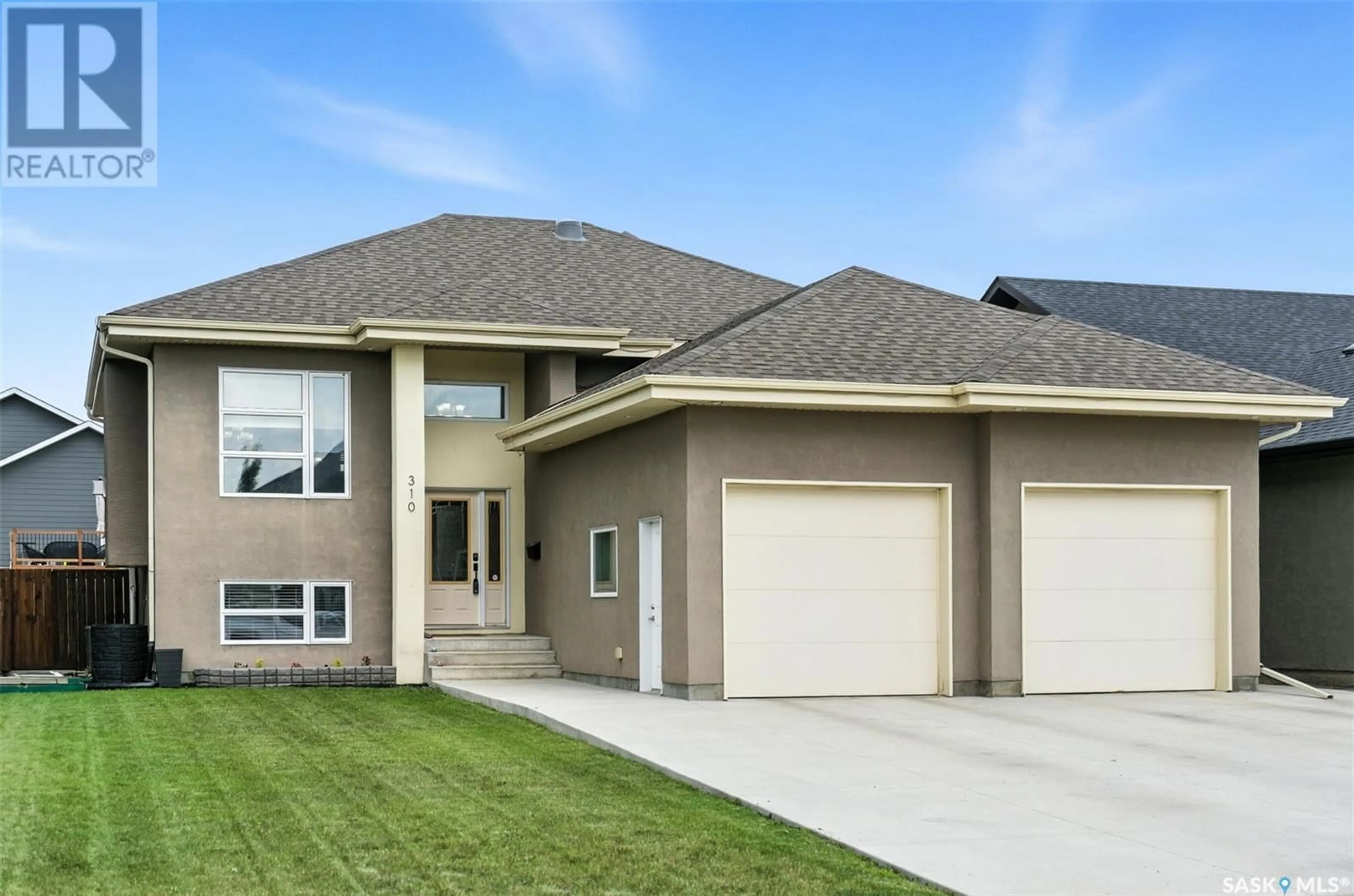 Home with vinyl exterior material, street for 310 AUGUSTA BOULEVARD, Warman Saskatchewan S0K4S1