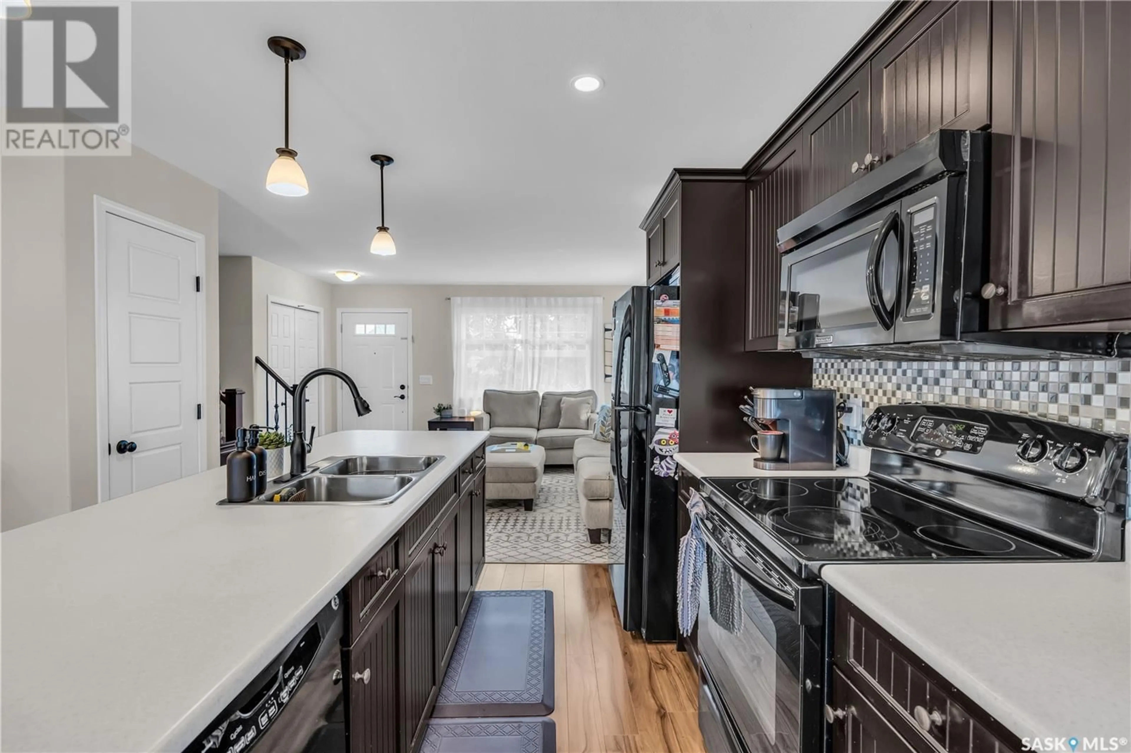 Open concept kitchen, ceramic/tile floor for 226 LANGLOIS WAY, Saskatoon Saskatchewan S7T0L2
