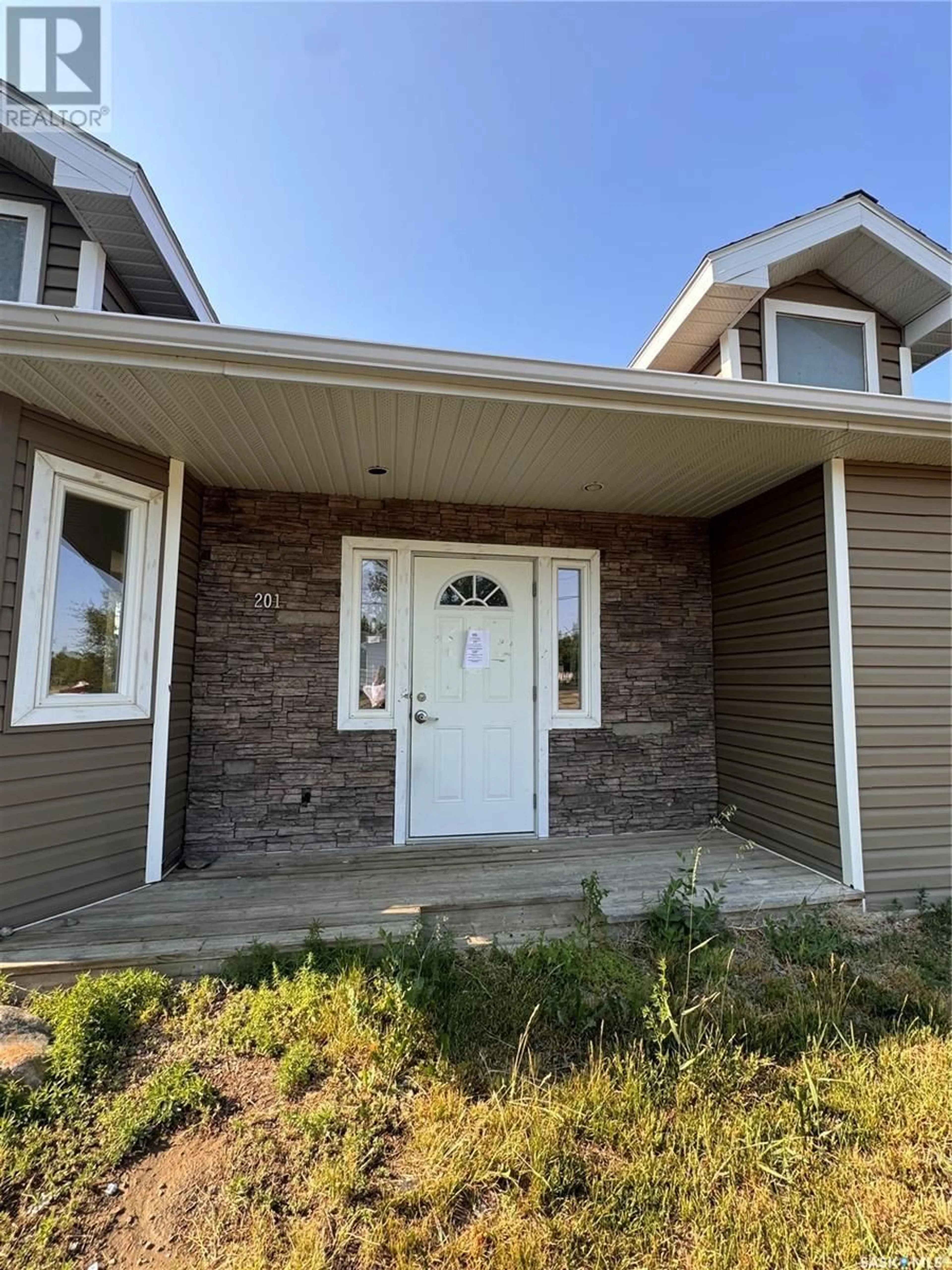 Home with vinyl exterior material, street for 201 3RD STREET, Milden Saskatchewan S0L2L0