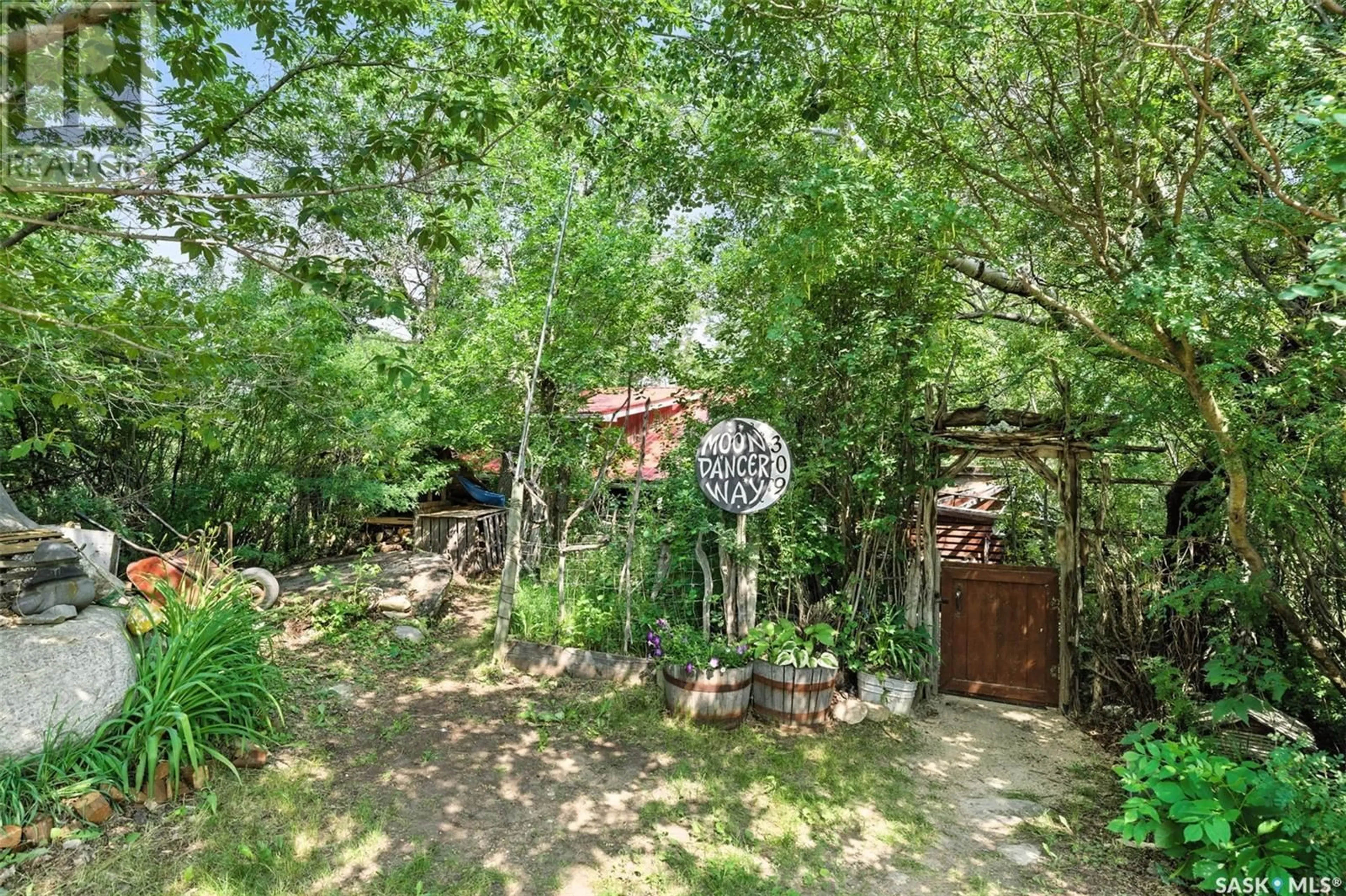 Patio, forest/trees view for 309 EVENSON AVENUE, Manitou Beach Saskatchewan S0K4T1